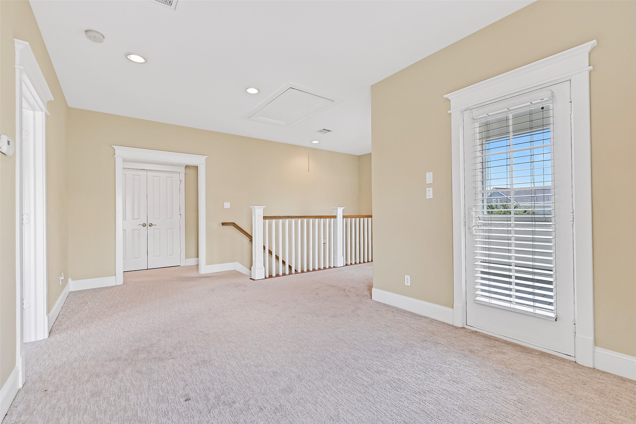 The flex space even has a private covered balcony, which is accessed from the storm door to the right.