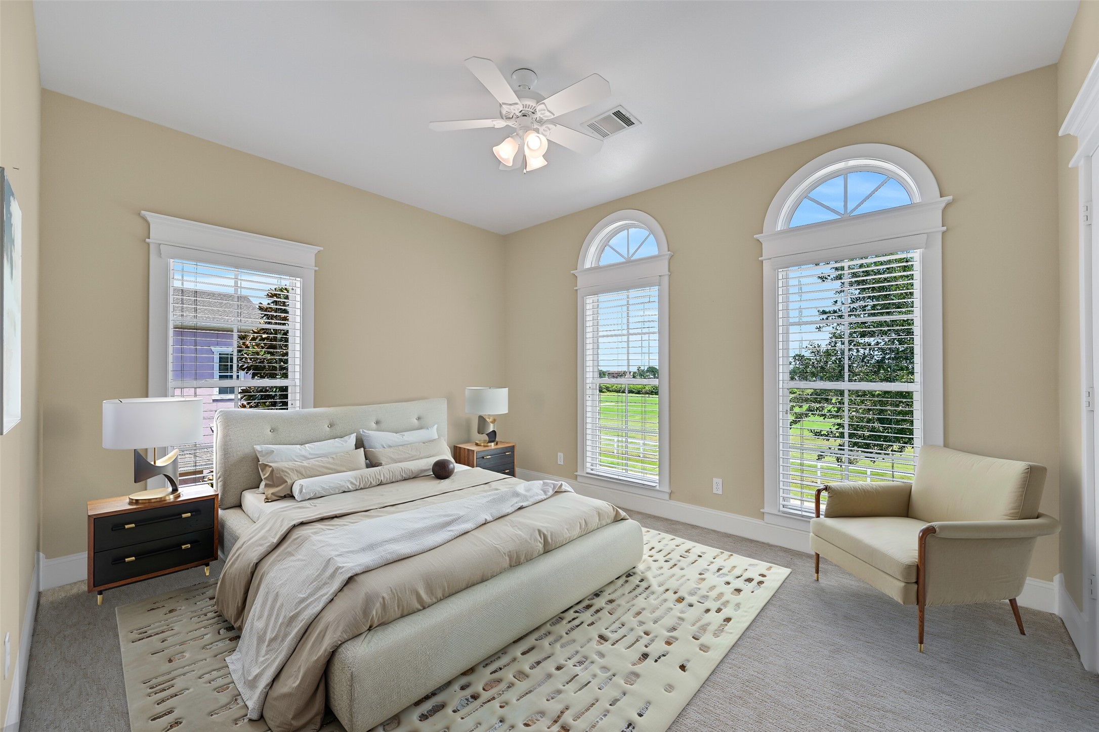 2nd bedroom, with sweeping golf course views. This photo is virtually-staged.