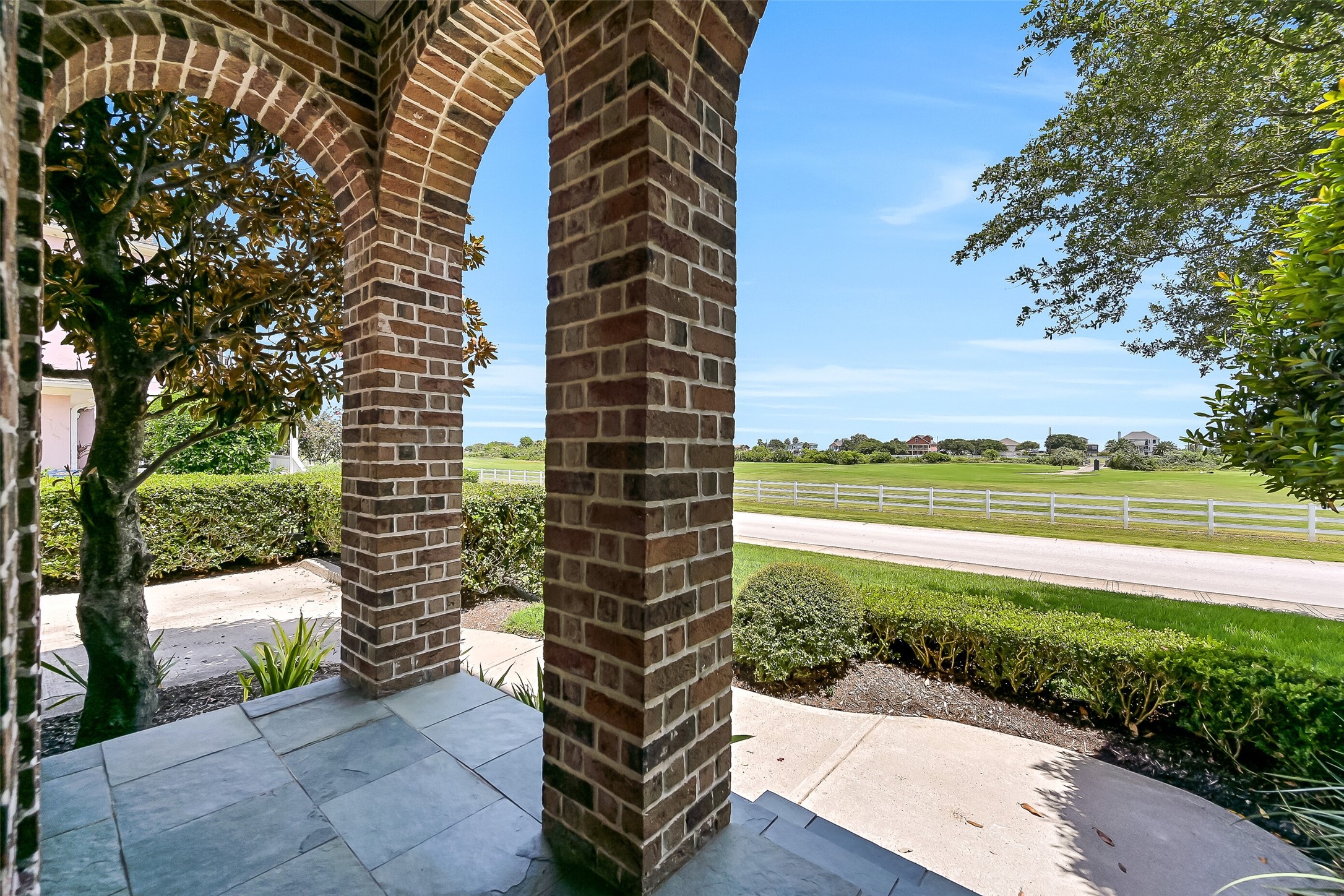 This East-facing covered porch enjoys vistas of the Moody Gardens Golf Course. This East-facing covered porch enjoys vistas of the Moody Gardens Golf Course.