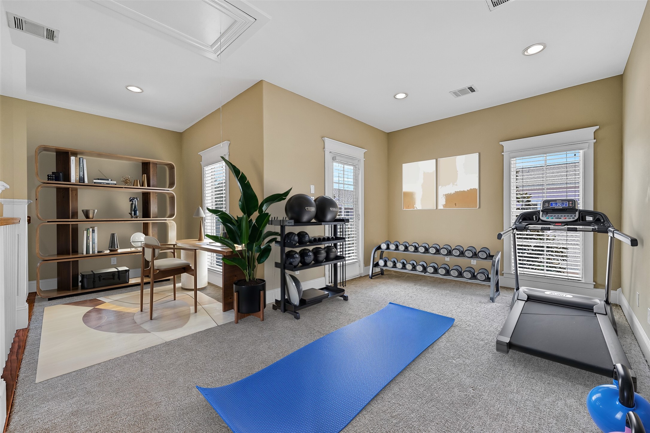 Once to the second level landing, we come to this versatile flex space. This could be a workout area, home office, second living area - your choice! This photo is virtually-staged.