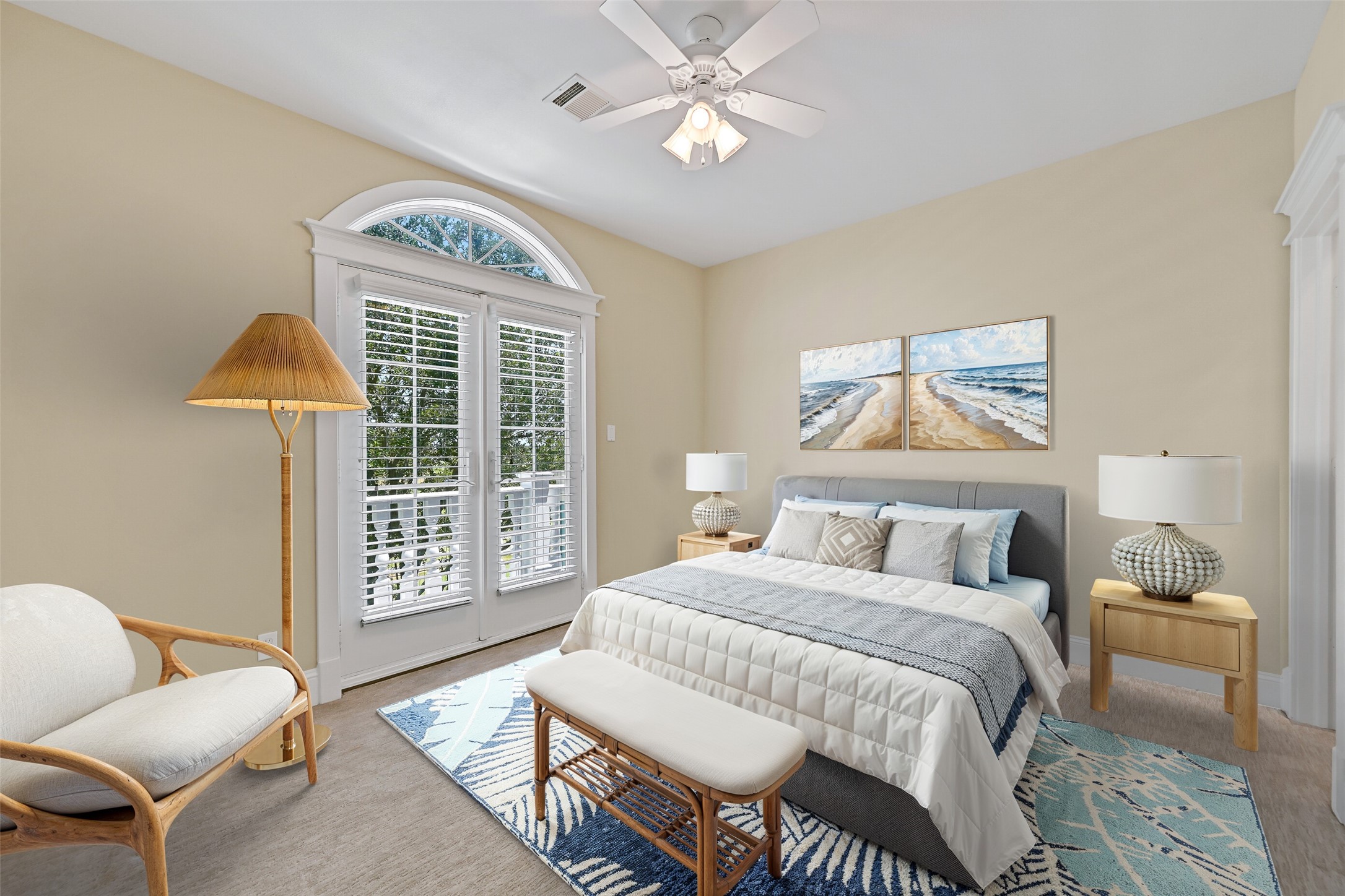 3rd bedroom which features a private balcony. This photo is virtually-staged.