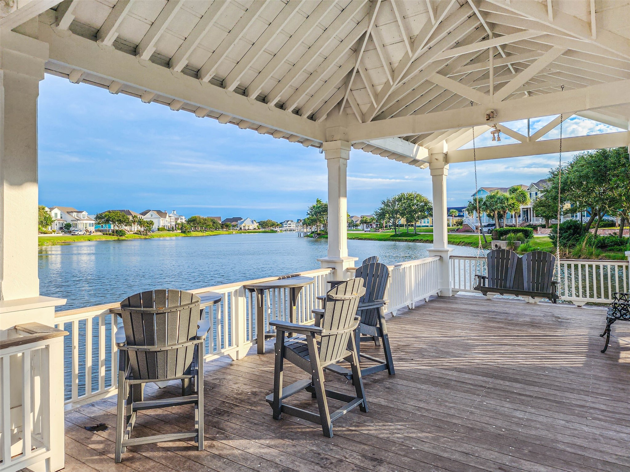Gazebos such as these dot the multiple lakes throughout the subdivision, offering peaceful gathering spaces for you to enjoy all year around. Check out these stunning water & sunset views.