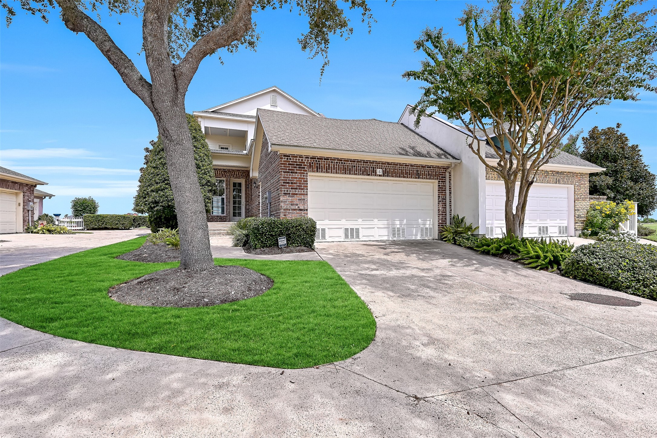 A double car driveway leads to the garage.