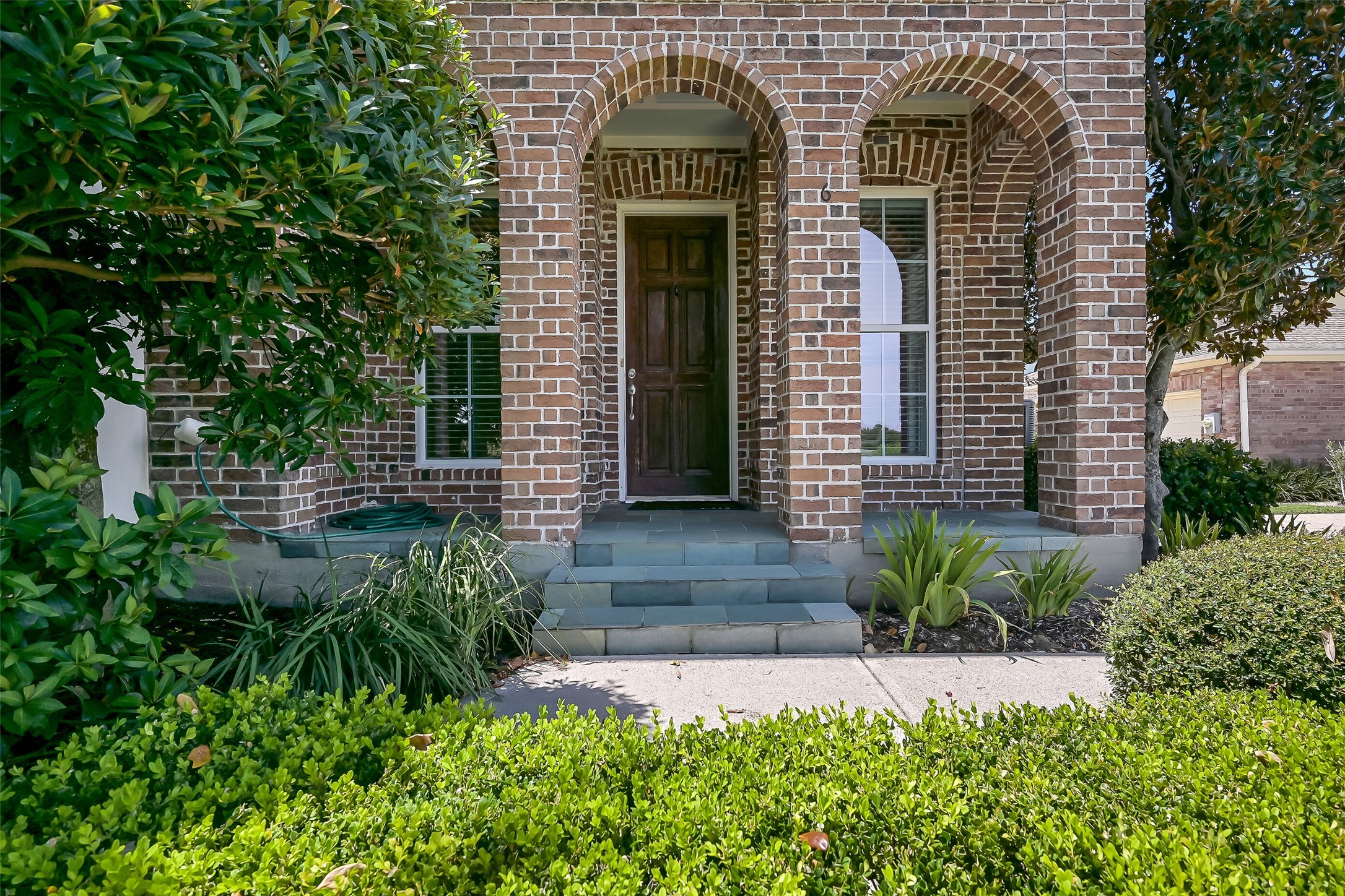 Beautiful landscaping envelopes the townhome. This is taken care of by the association - great for those seeking worry free living! Beautiful landscaping envelopes the townhome. This is taken care of by the association - great for those seeking worry free living!