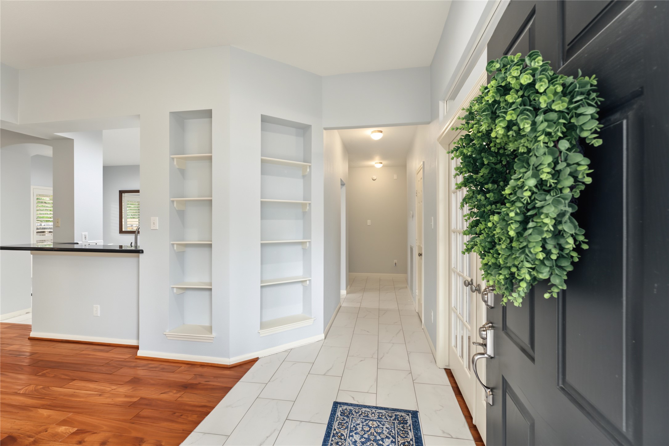 Welcoming entry with built in shelving