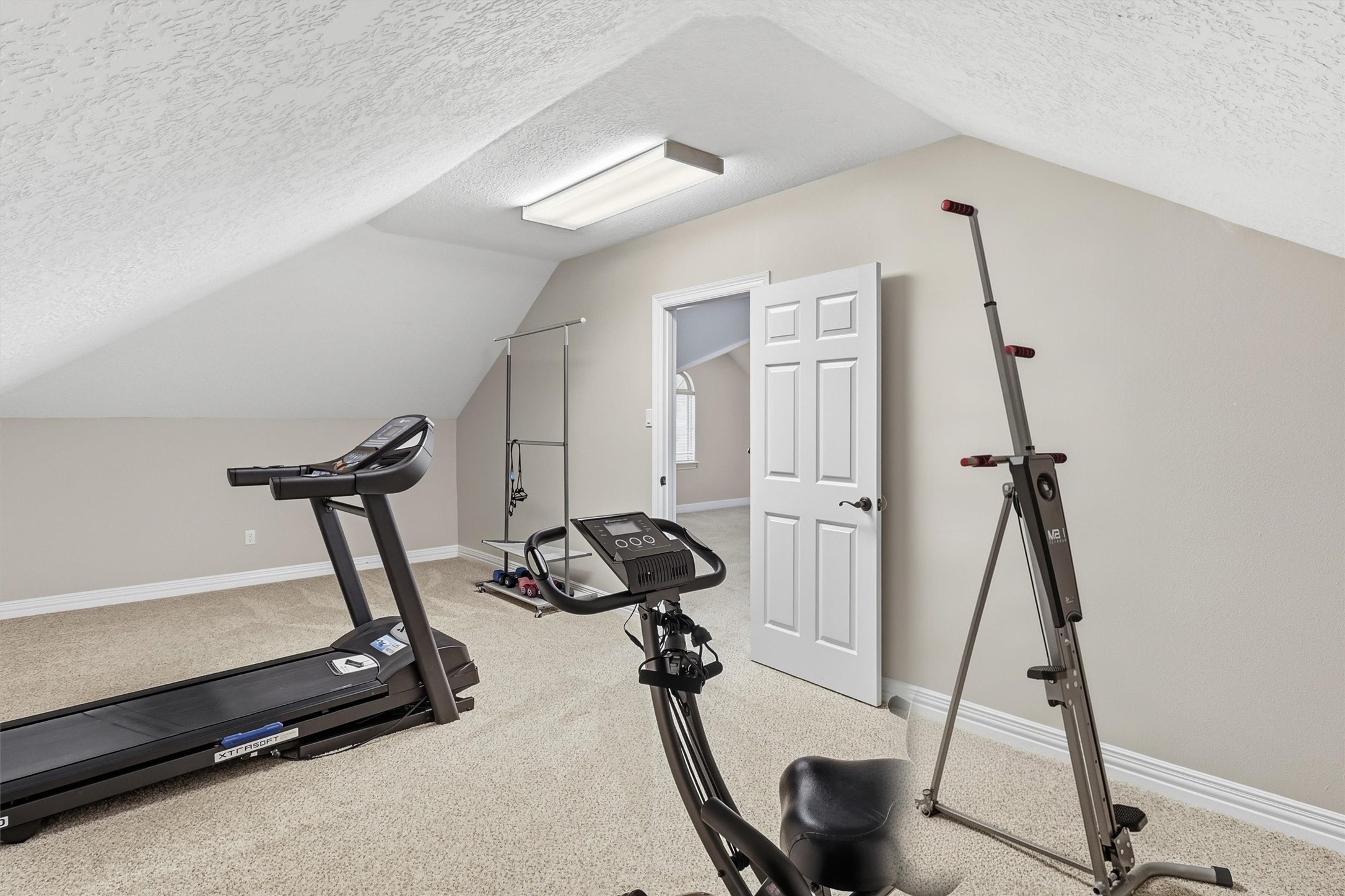This versatile bonus room offers ample space for a home gym, complete with room for equipment and storage. A great option for those seeking a dedicated fitness space at home.