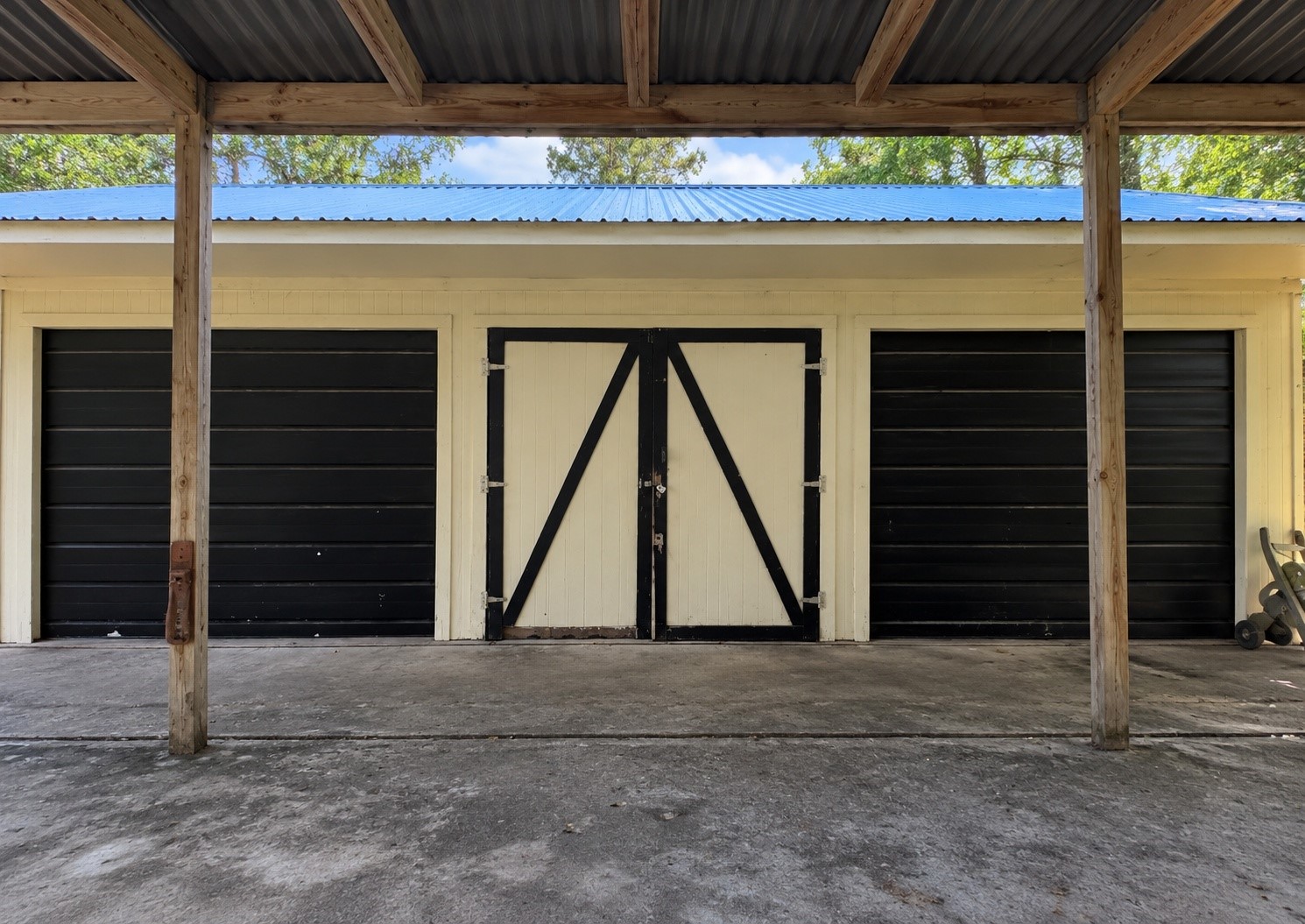 Detached garage with a covered approach and space for storage or potential workshop use
