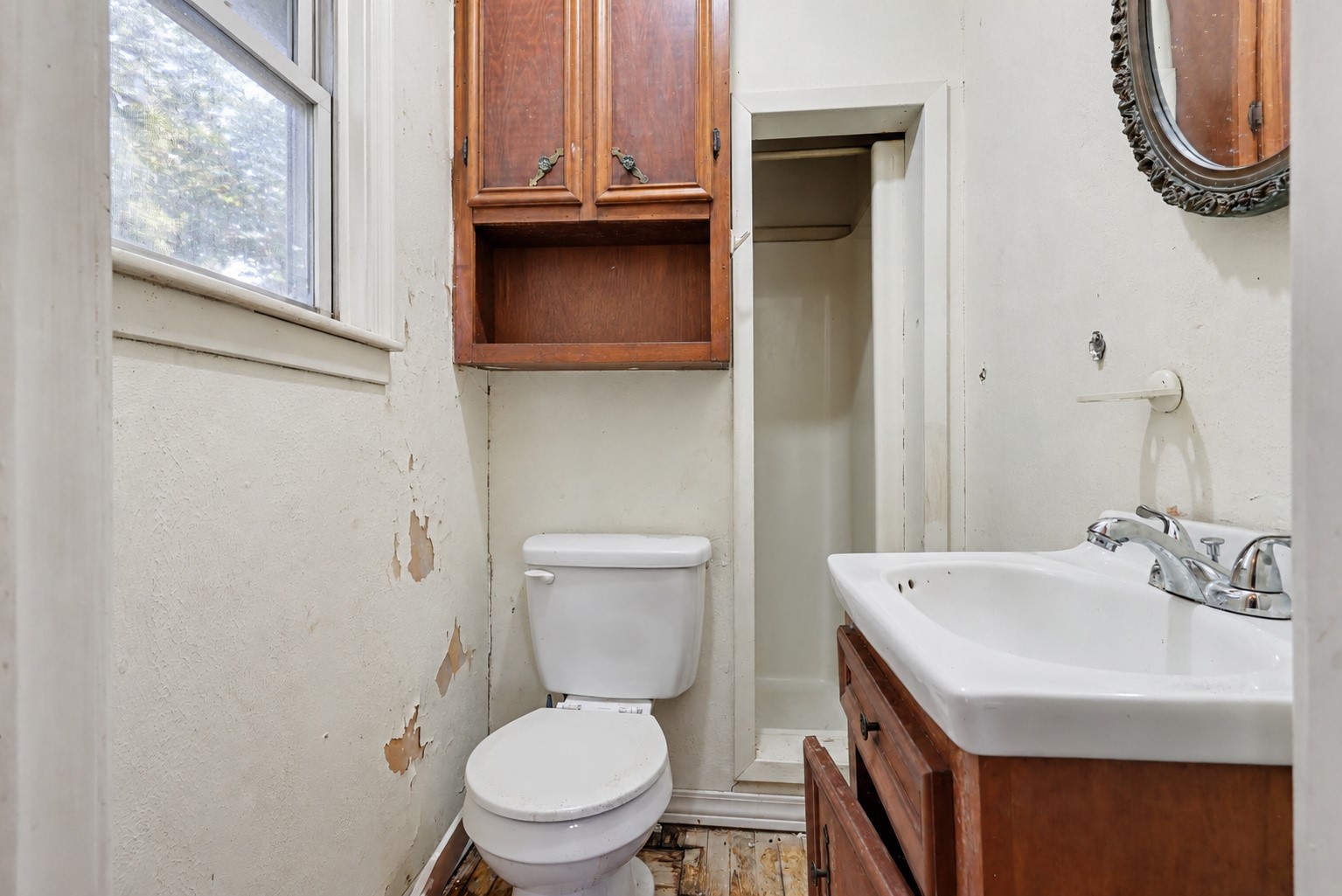 Bathroom attached to Bedroom 1 with shower and vanity-Digitally edited to remove curtains and personal items
