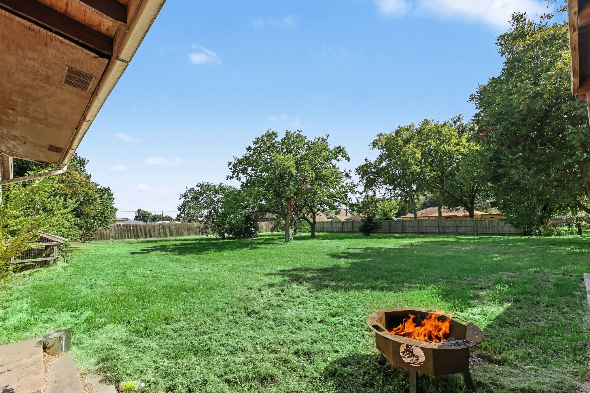 Spacious Backyard with mature trees and plenty of room for outdoor gatherings