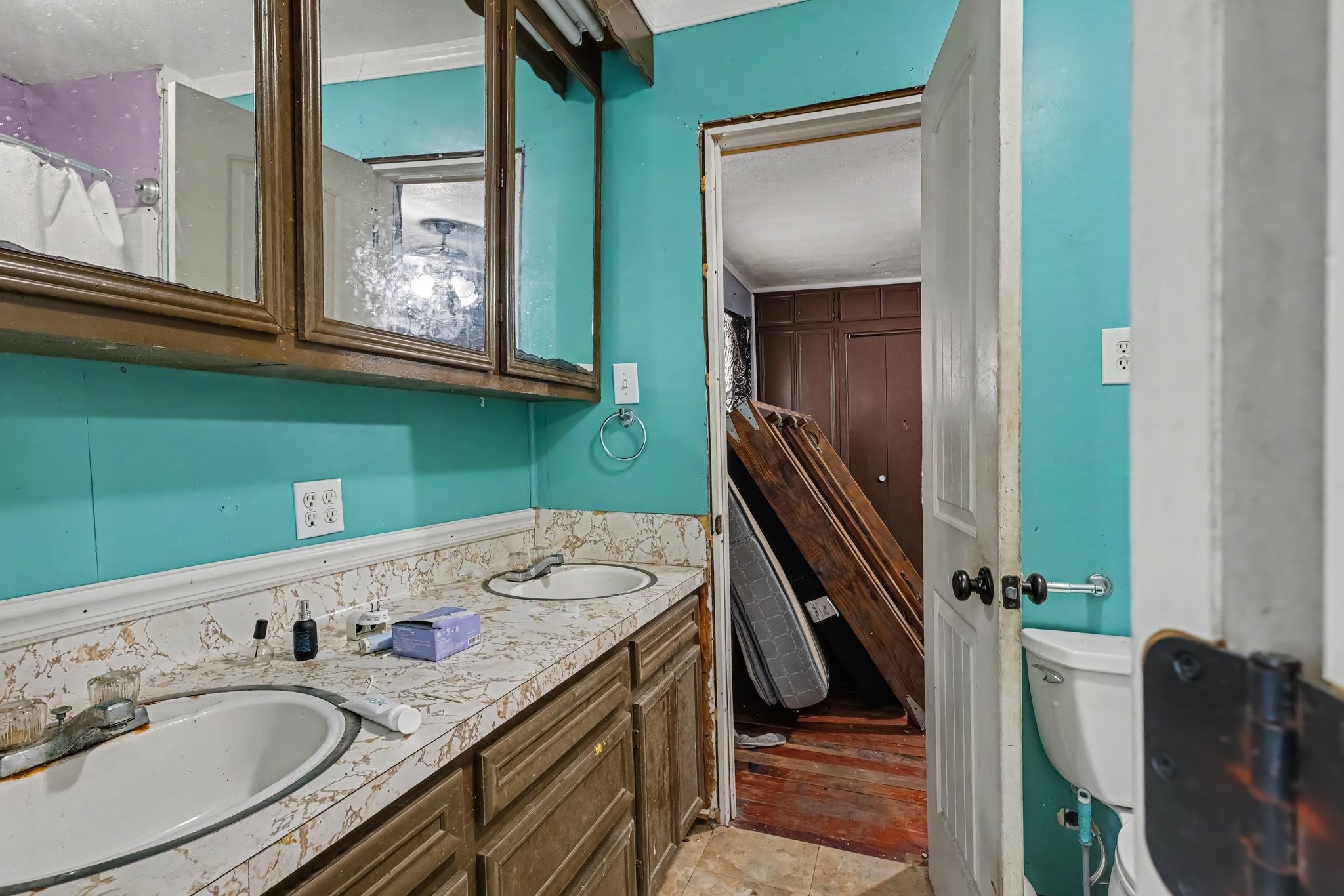 Shared Bathroom connecting Bedrooms 2 and 3- Featuring a double-sink vanity.