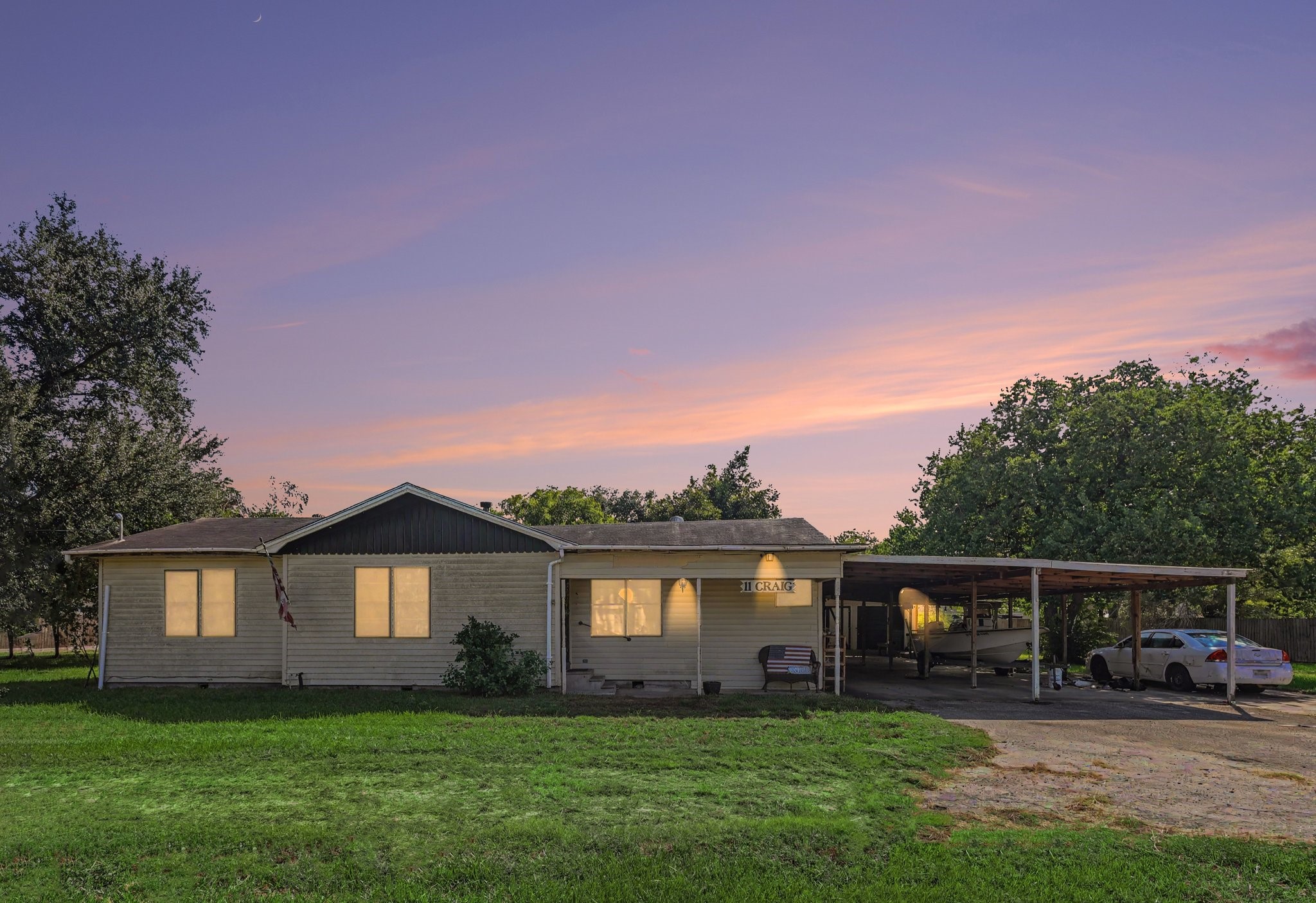 Front exterior photo enhanced with AI to simulate twilight and lighting