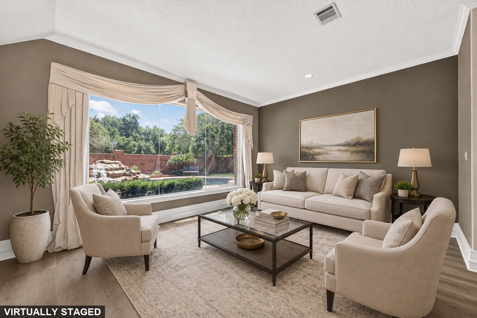 Virtually staged sitting area with beautiful view of backyard pool/spa with waterfall feature