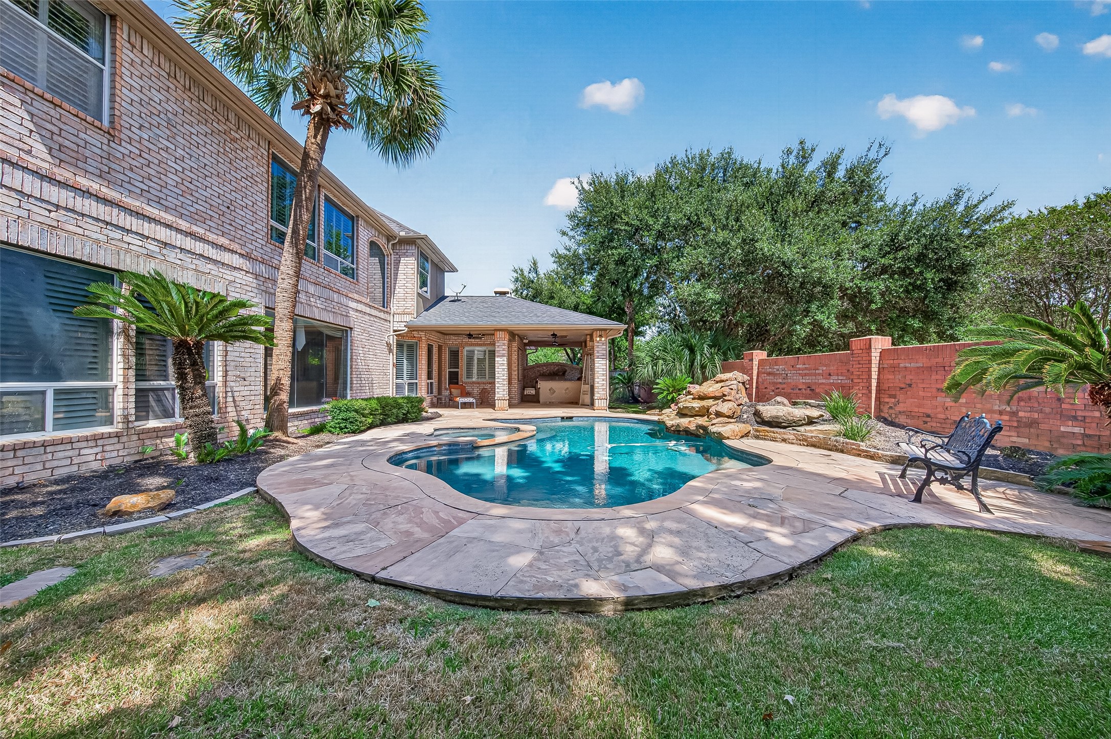 Oversized backyard complete with a pool and spa, extended covered patio and amazing outdoor kitchen for you to extend your living outside