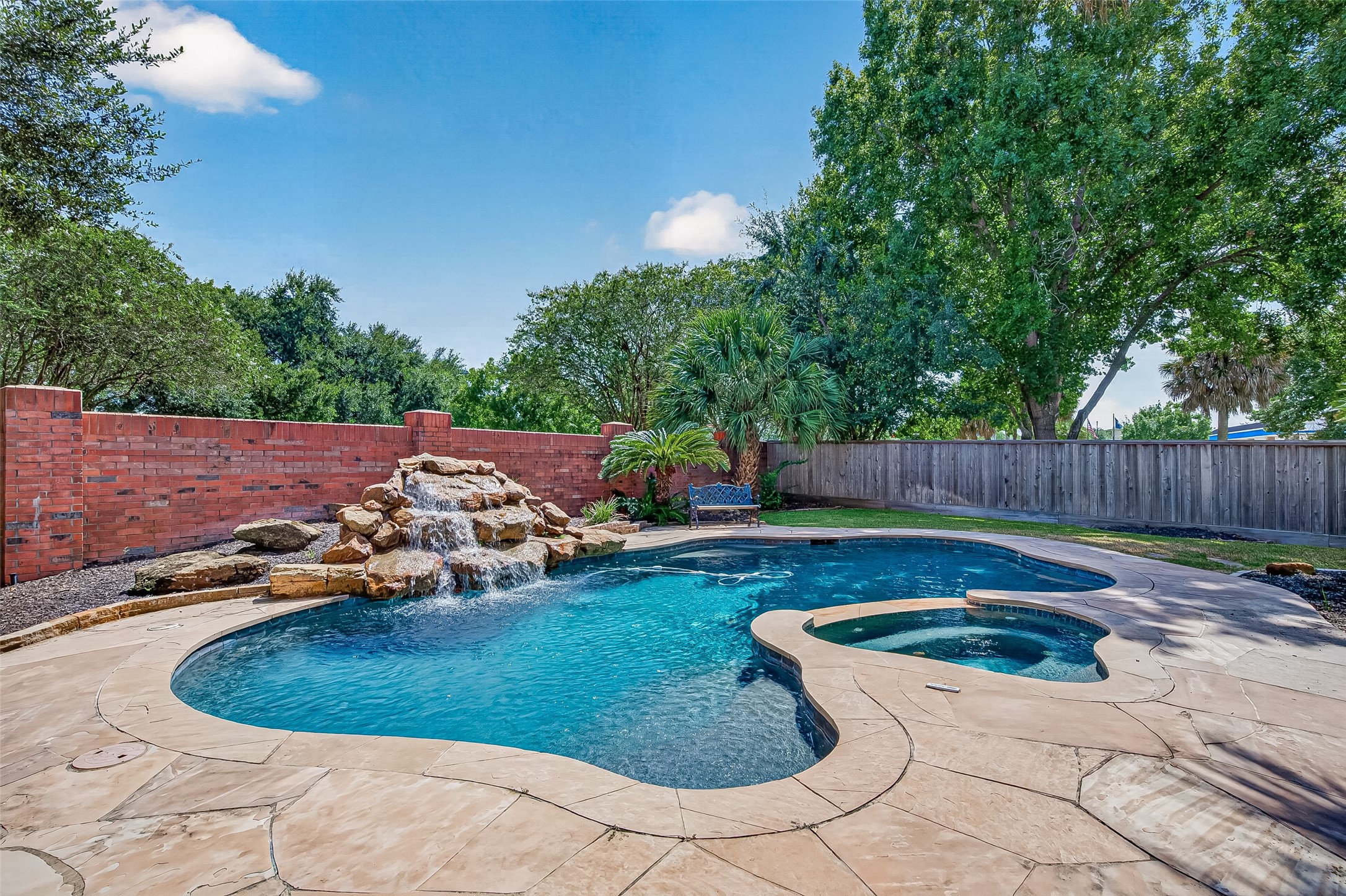 Another look at your stunning pool and spa with a cascading waterfall feature
