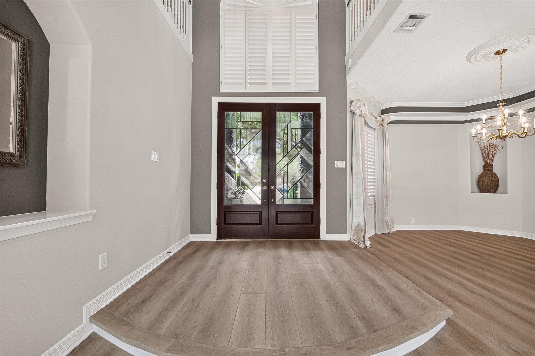 Soaring ceilings and large windows bring in an abundance of natural light into this beautiful home.