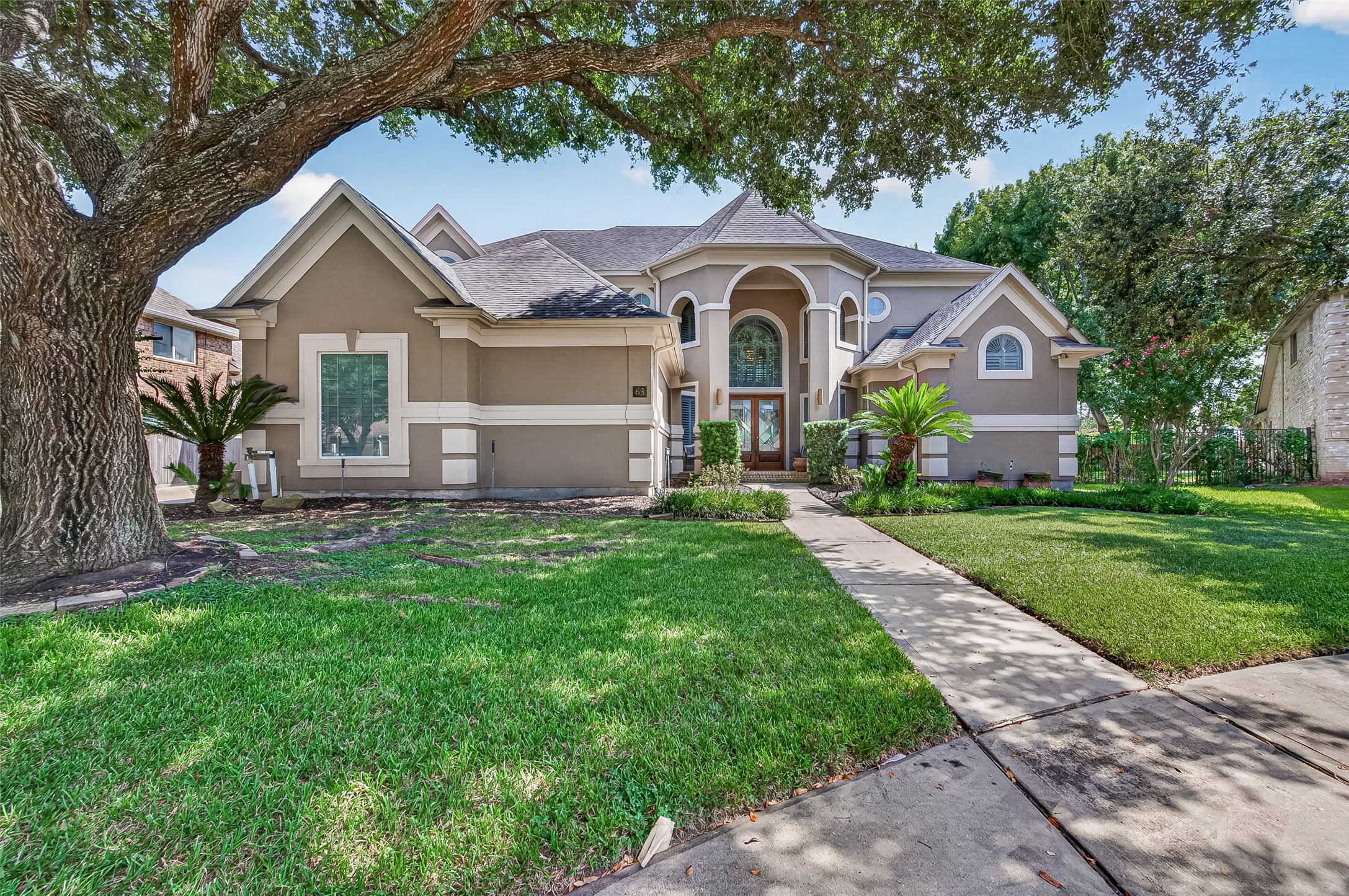Welcome to 63 Harbor View! Exquisite home boasting a stunning curb appeal located on a cul-de-sac inside the gated Pointe Royale at New Territory.