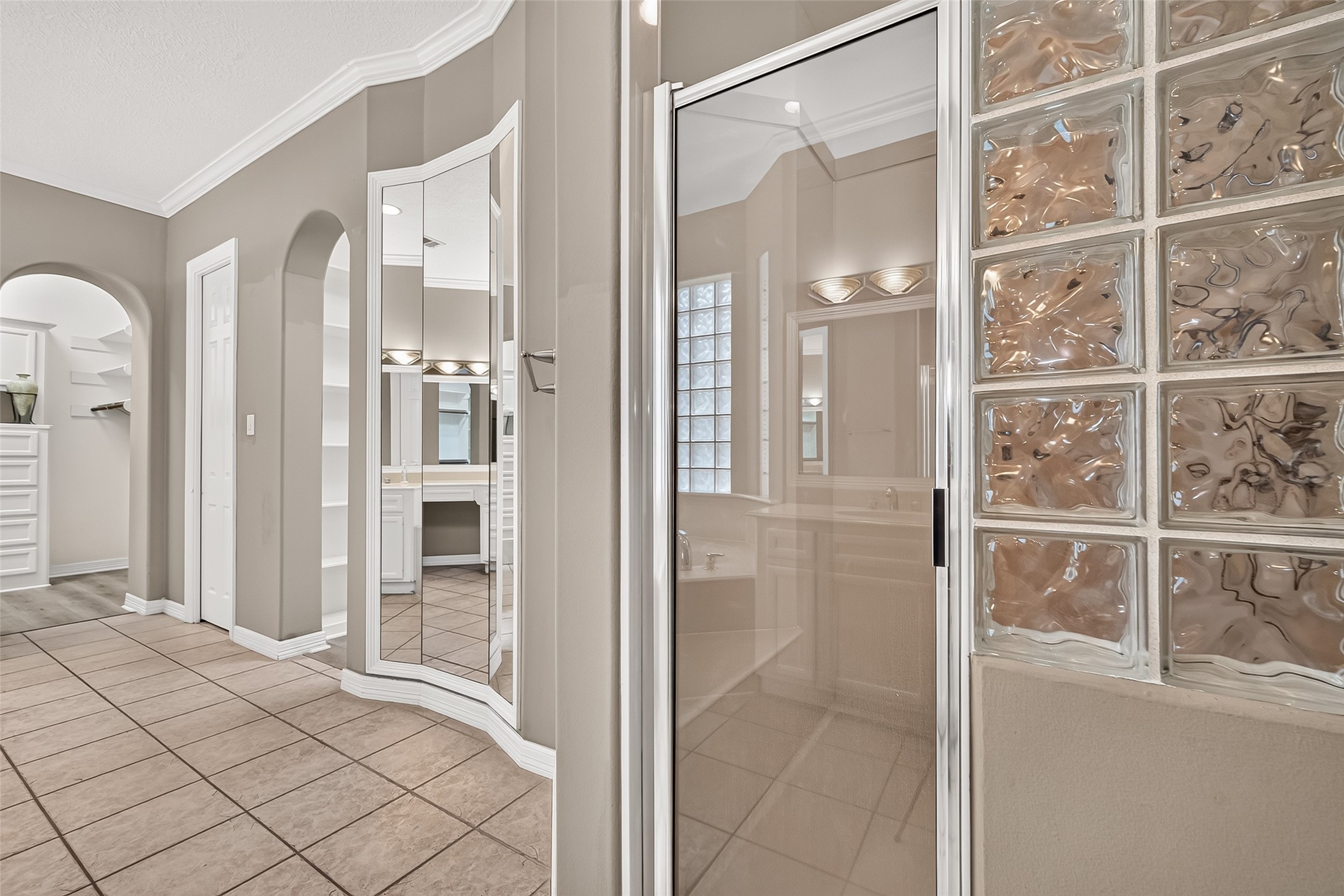 Separate shower and double closets in owner's bath
