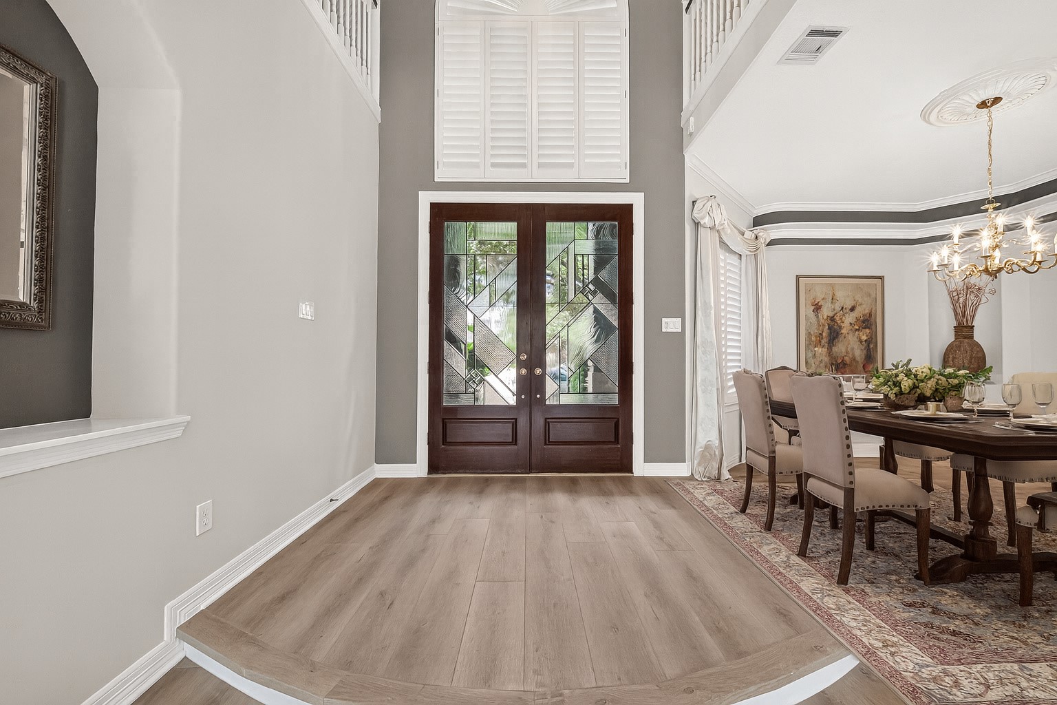 Virtually staged formal dining area right at the front of the home