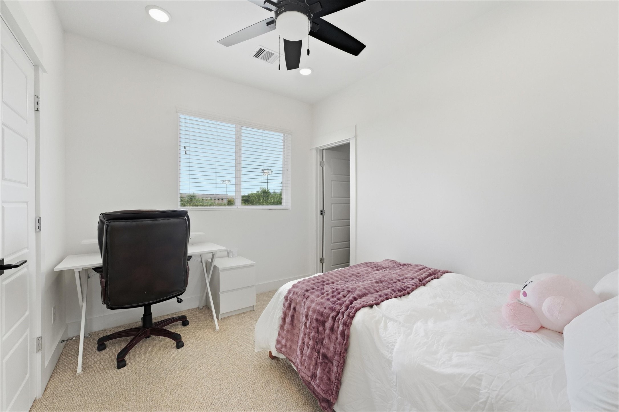 Third-floor bedroom with en suite bath.