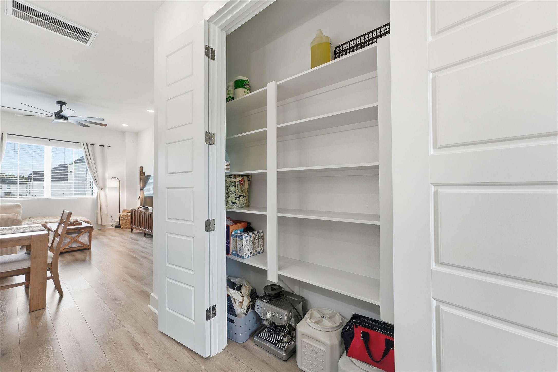 Pantry with plenty of shelving for storage.