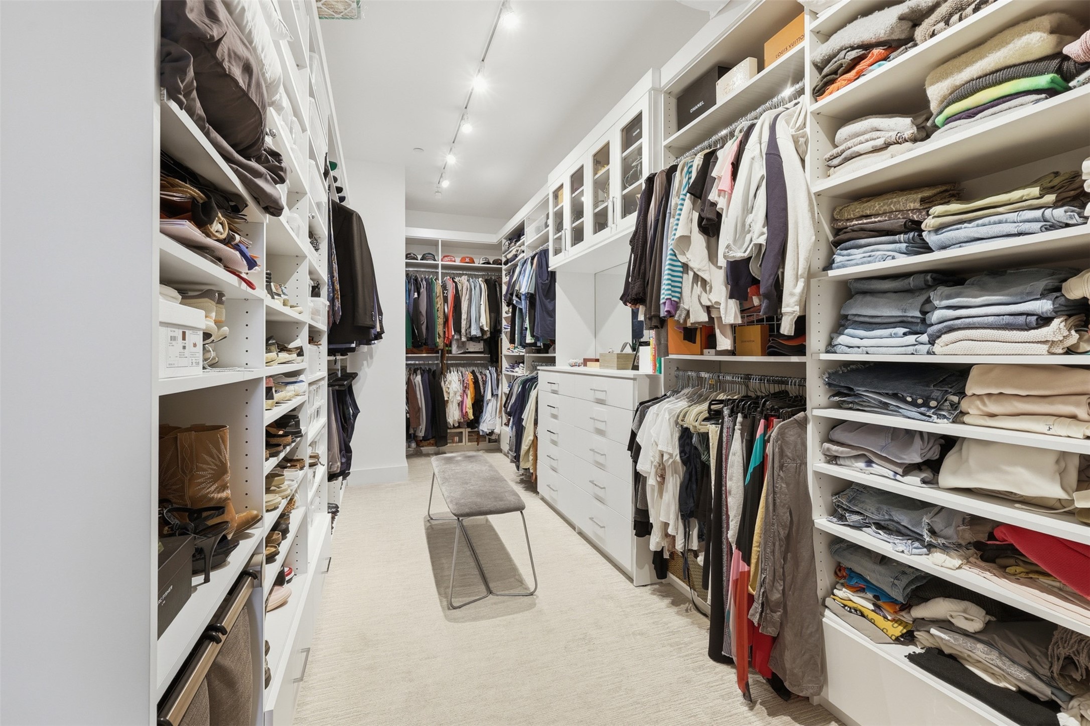 Custom built primary closet system.