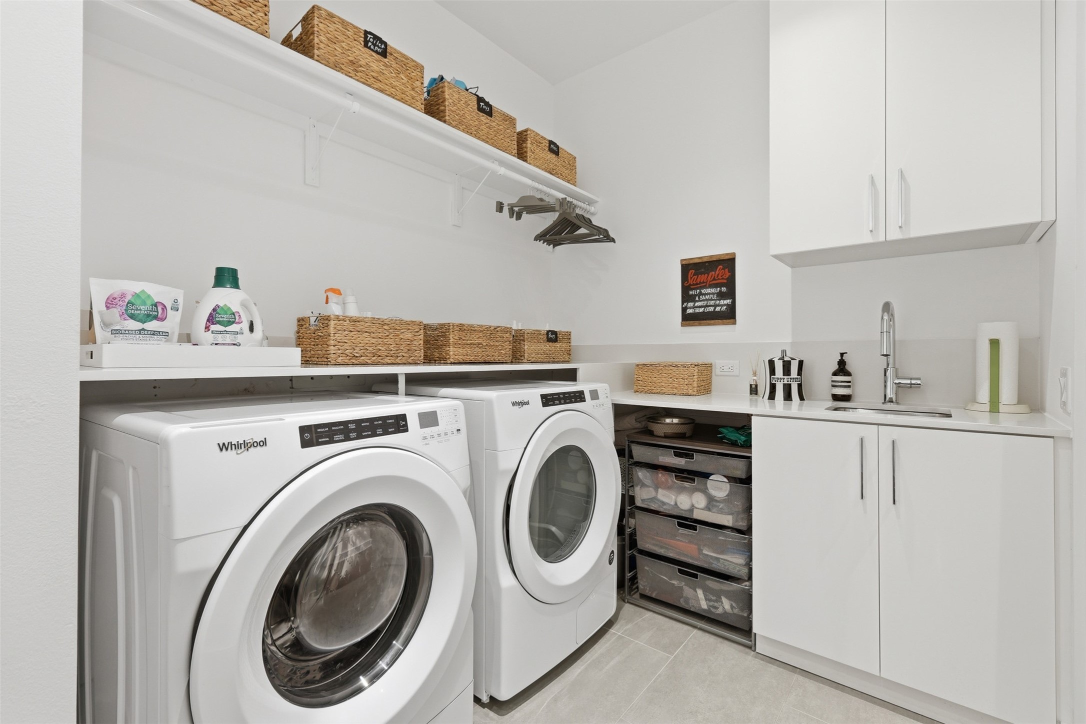 Large laundry room complete with a sink.