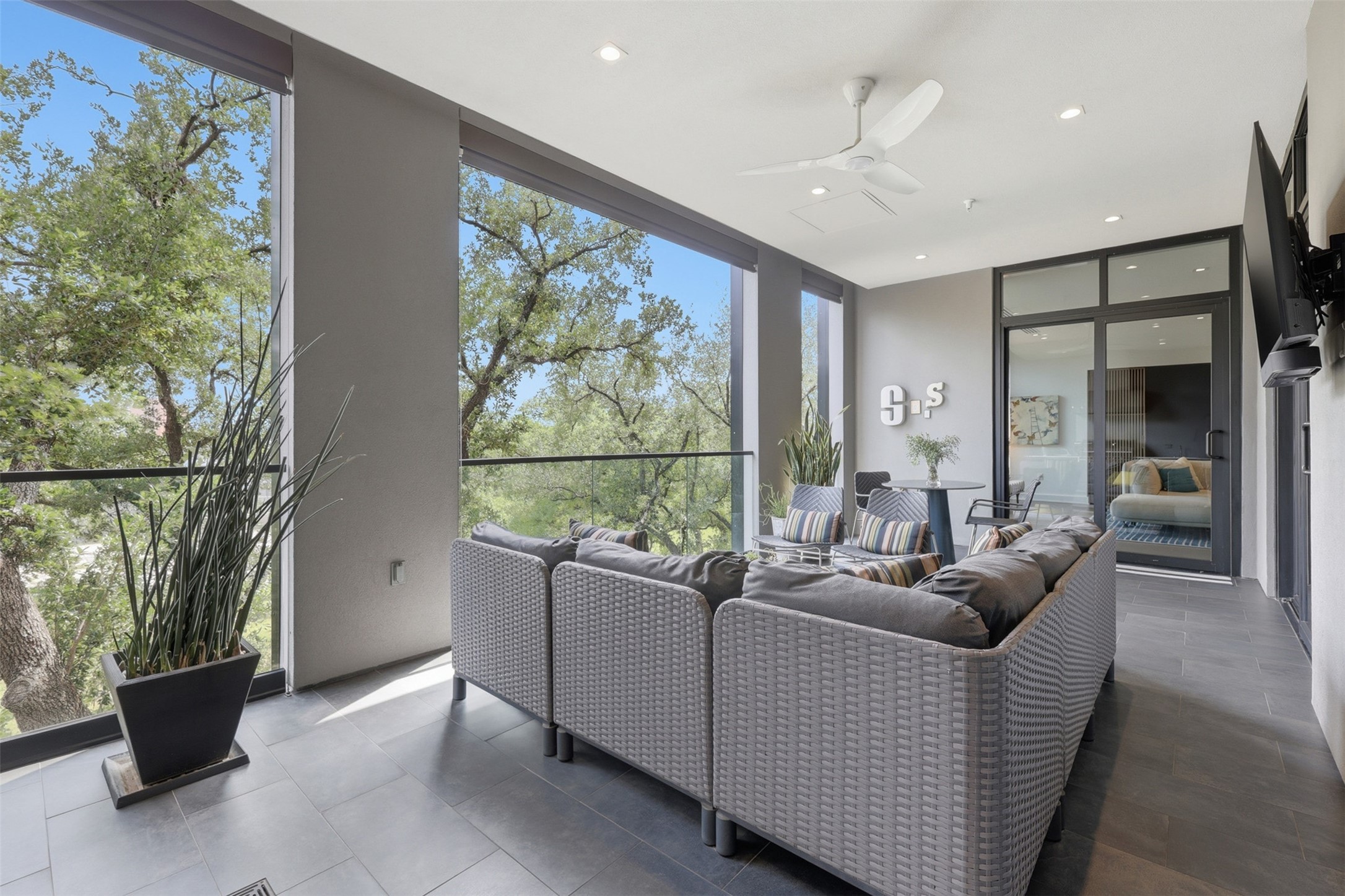 Automatic shades on the terrace provide additional protection from the elements.