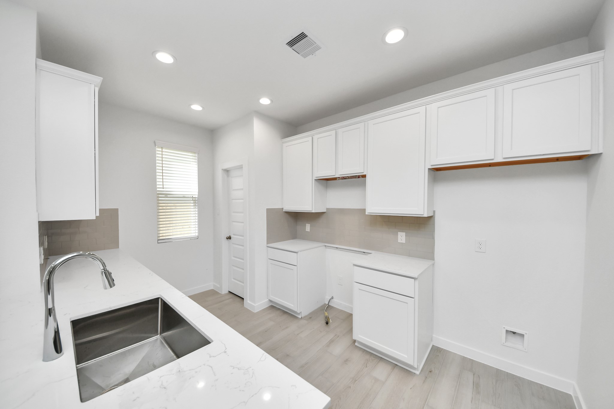 The extended counter area adds both practicality and style, making meal preparation a breeze. Every detail is thoughtfully designed to enhance the kitchen's functionality and aesthetic appeal. Sample photo of completed home with similar floor plan. Actual colors and selections may vary.
