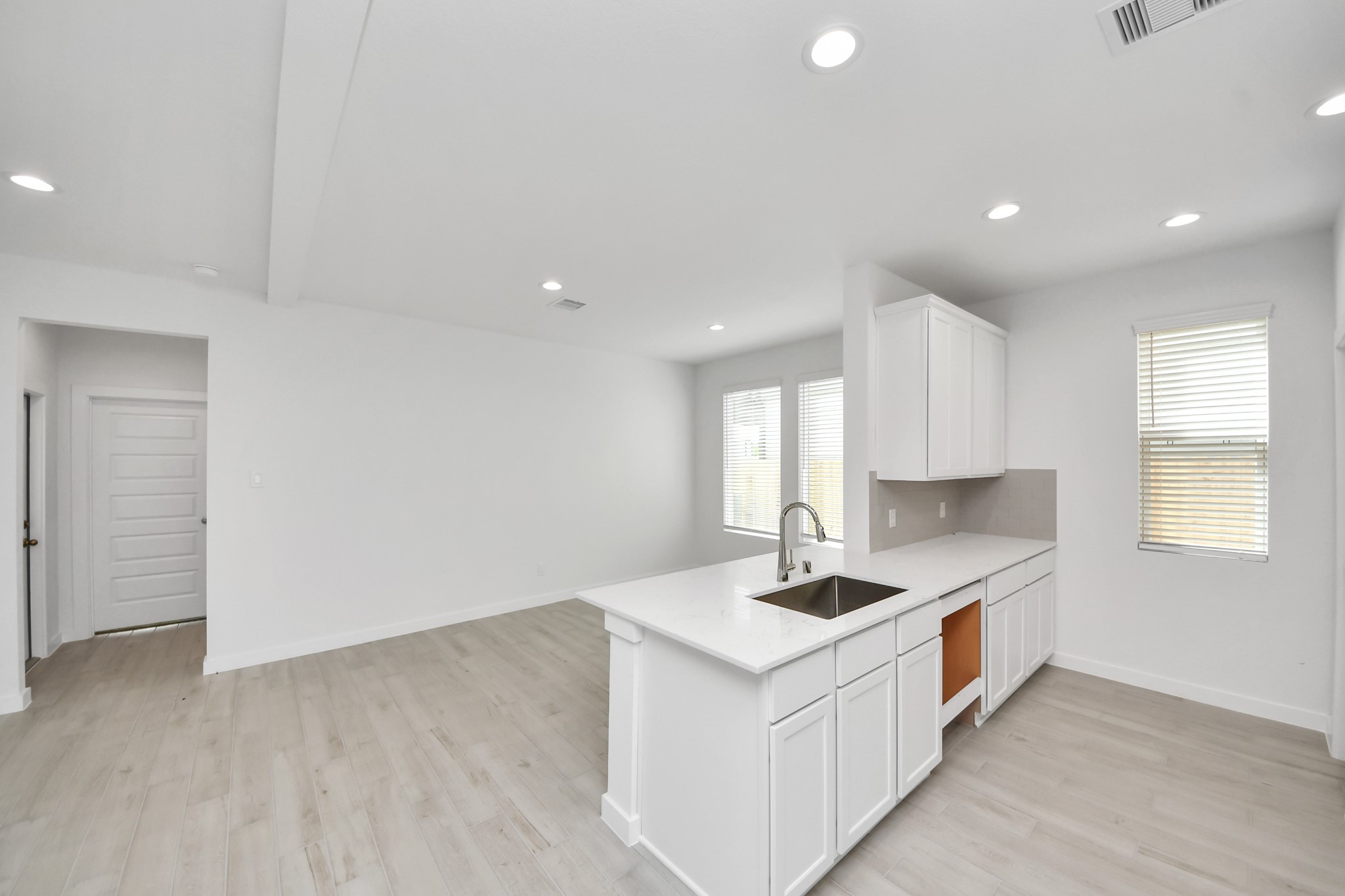 The open concept effortlessly connects the kitchen to the expansive family room, forming a perfect hub for gatherings. This seamless flow creates an inviting space where cooking and socializing come together harmoniously. Sample photo of completed home with similar floor plan. Actual colors and selections may vary.