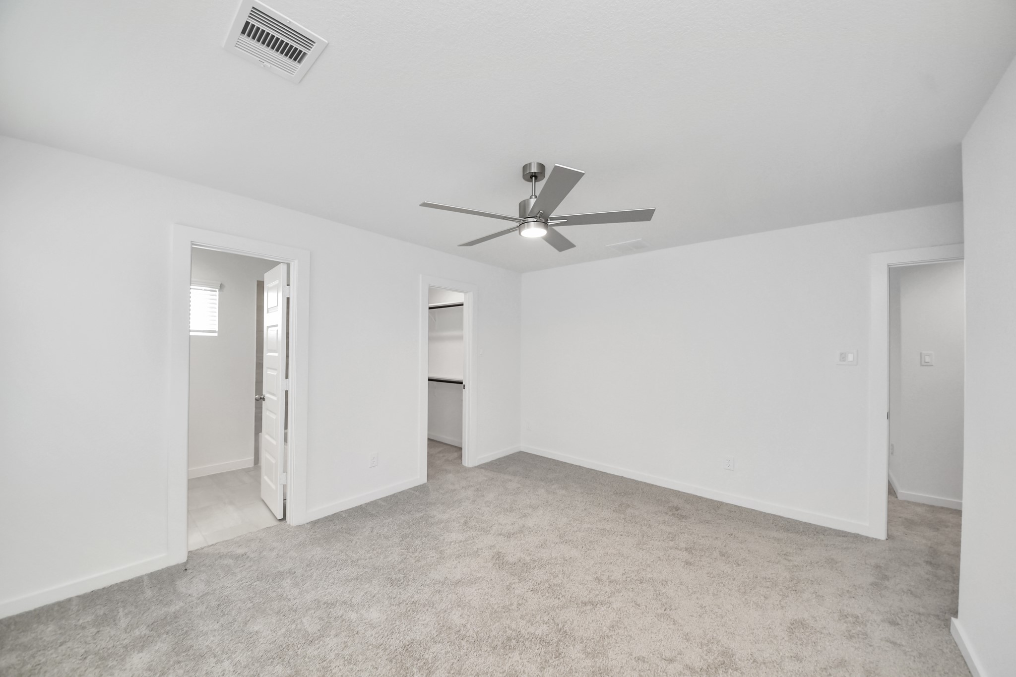 Generously sized secondary bedrooms featuring spacious closets, soft and inviting carpeting underfoot, large windows allowing plenty of natural light, and the added touch of privacy blinds for your personal retreat. Sample photo of completed home with similar floor plan. Actual colors and selections may vary.