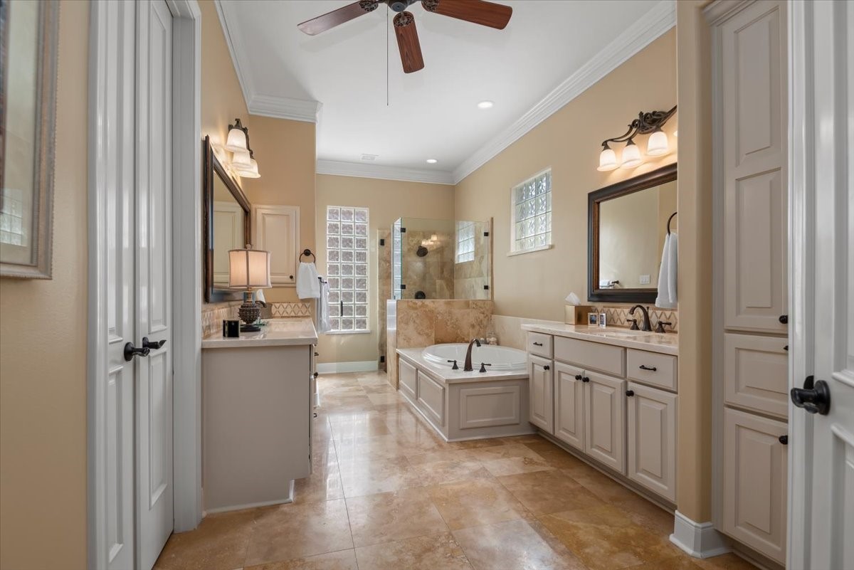 The primary bathroom boasts dual vanities, a garden tub and seperate shower.
