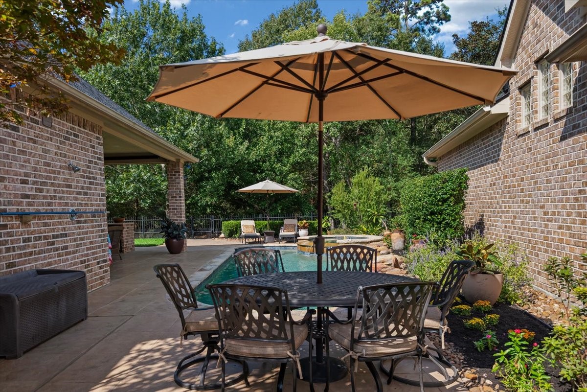 Second outdoor patio area at the east end of the pool. On the wall (at left) there is an outdoor shower.