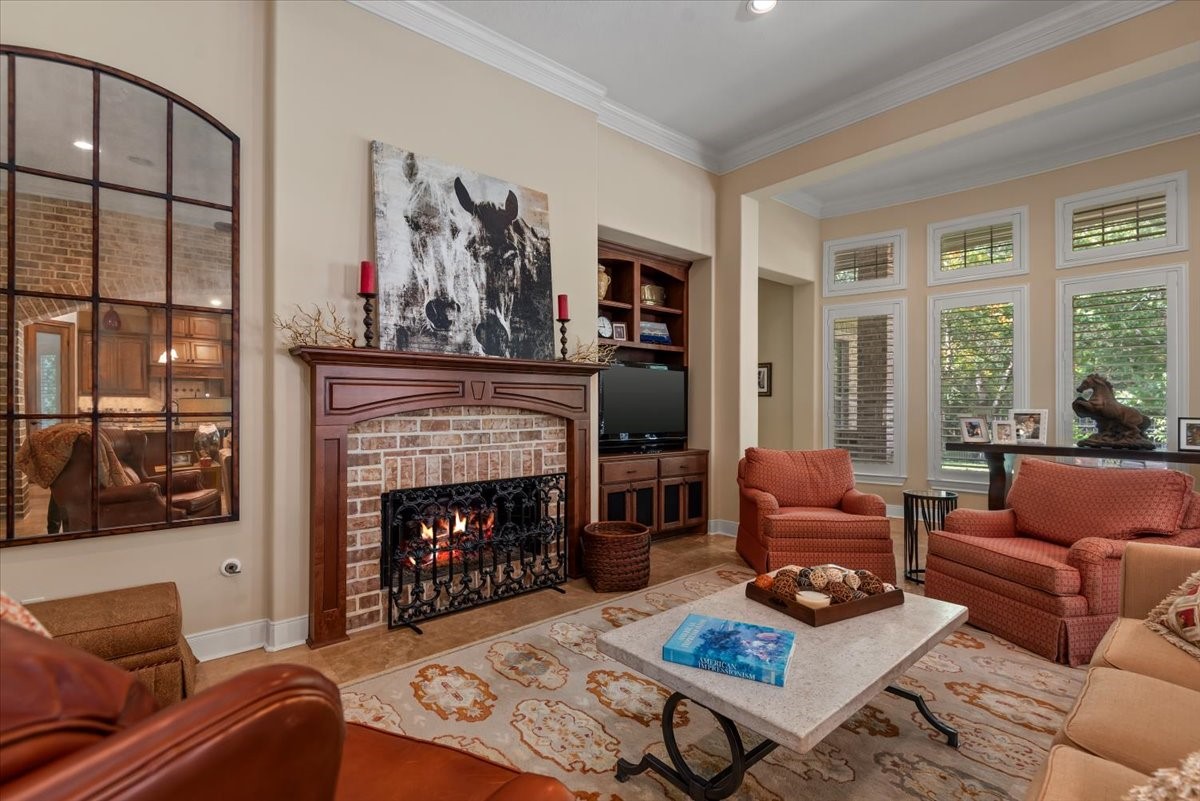 The brick gas log fireplace compliments the brick archway.