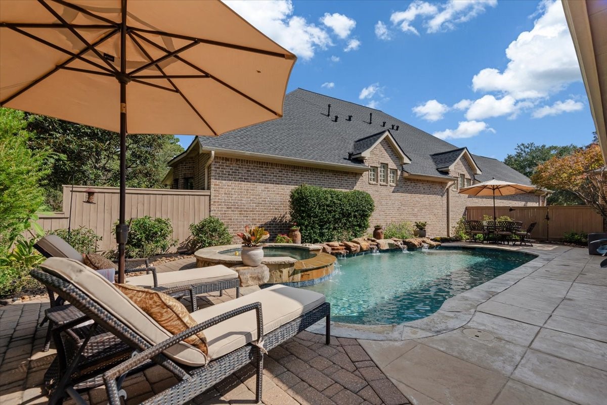 Gorgeous! The pool equipment and AC are located behind the wood fence at the far end of this photo.