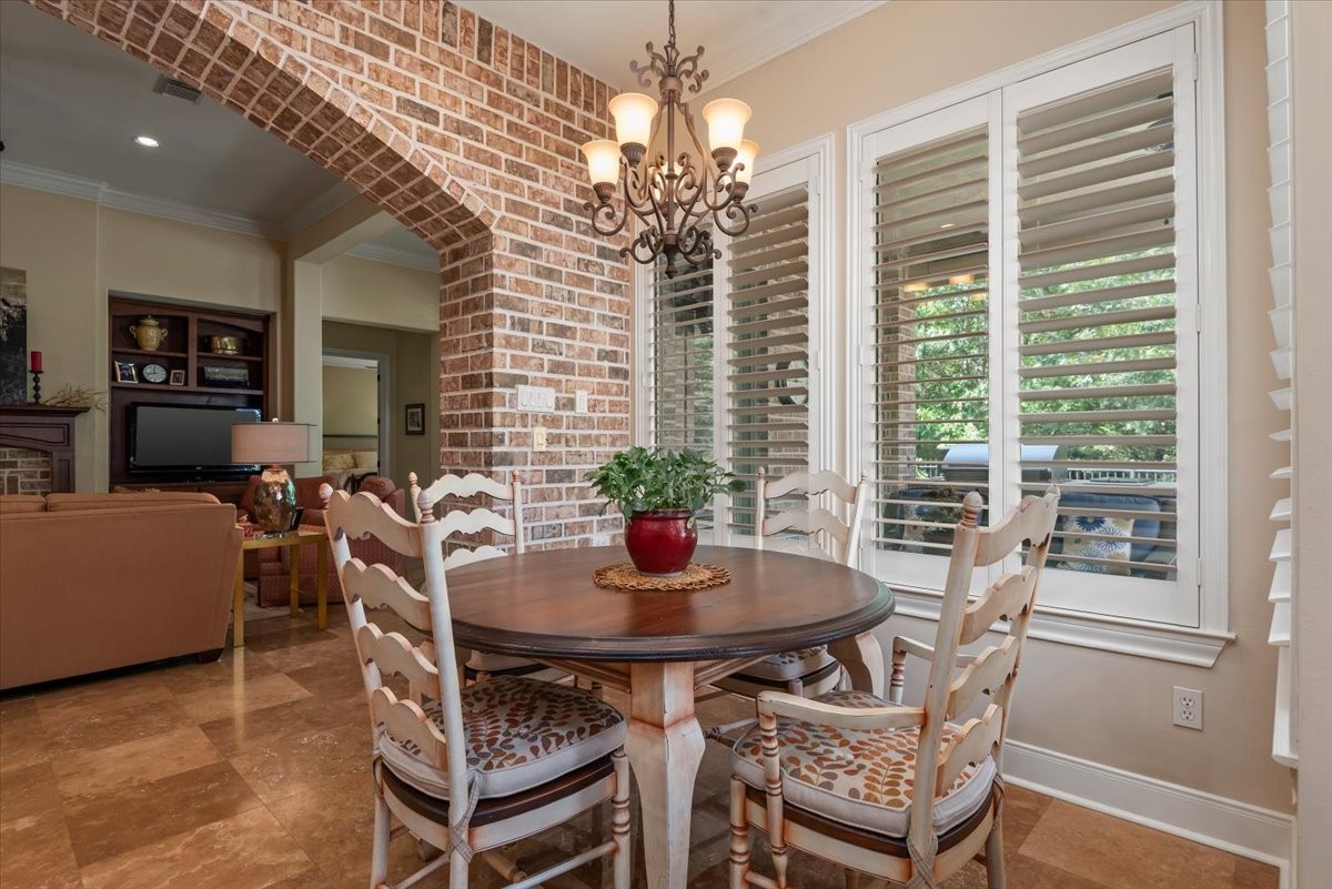 Plantation shutters dress the windows in the breakfast room, living room and bedrooms.