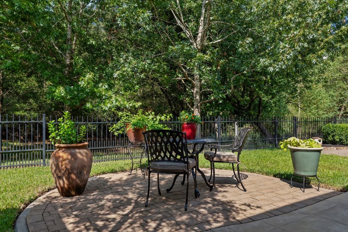 Intimate and peaceful brick paver patio to enjoy the wooded reserve.