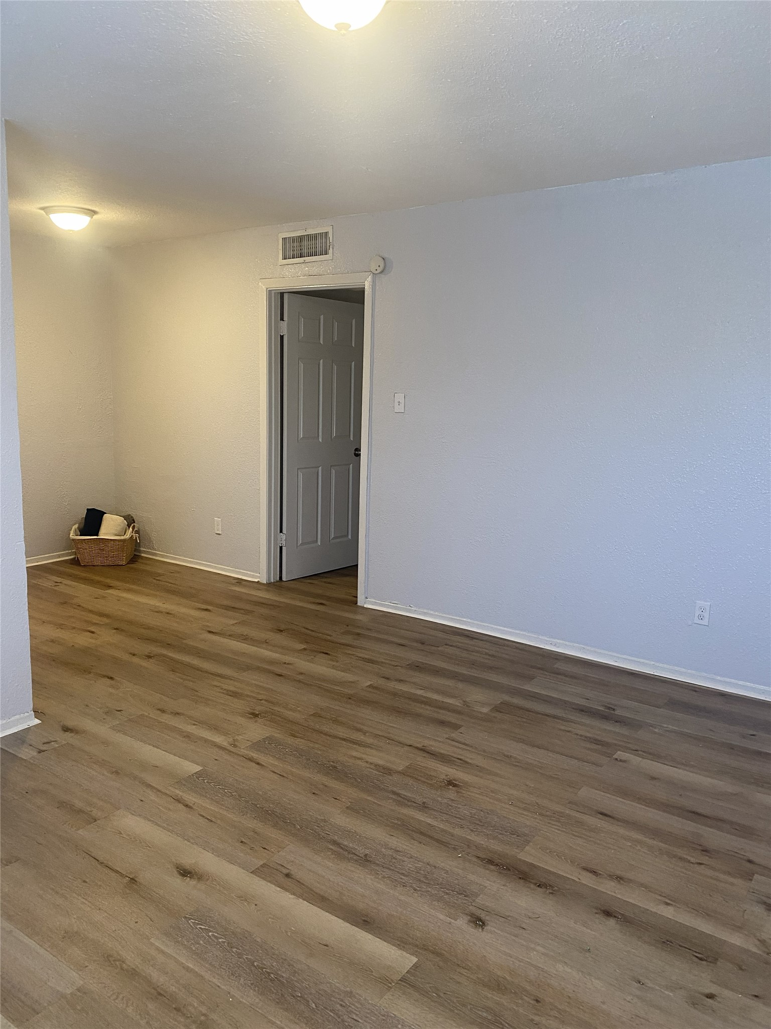 Spacious living room and dining room. New flooring Spacious living room and dining room. New flooring