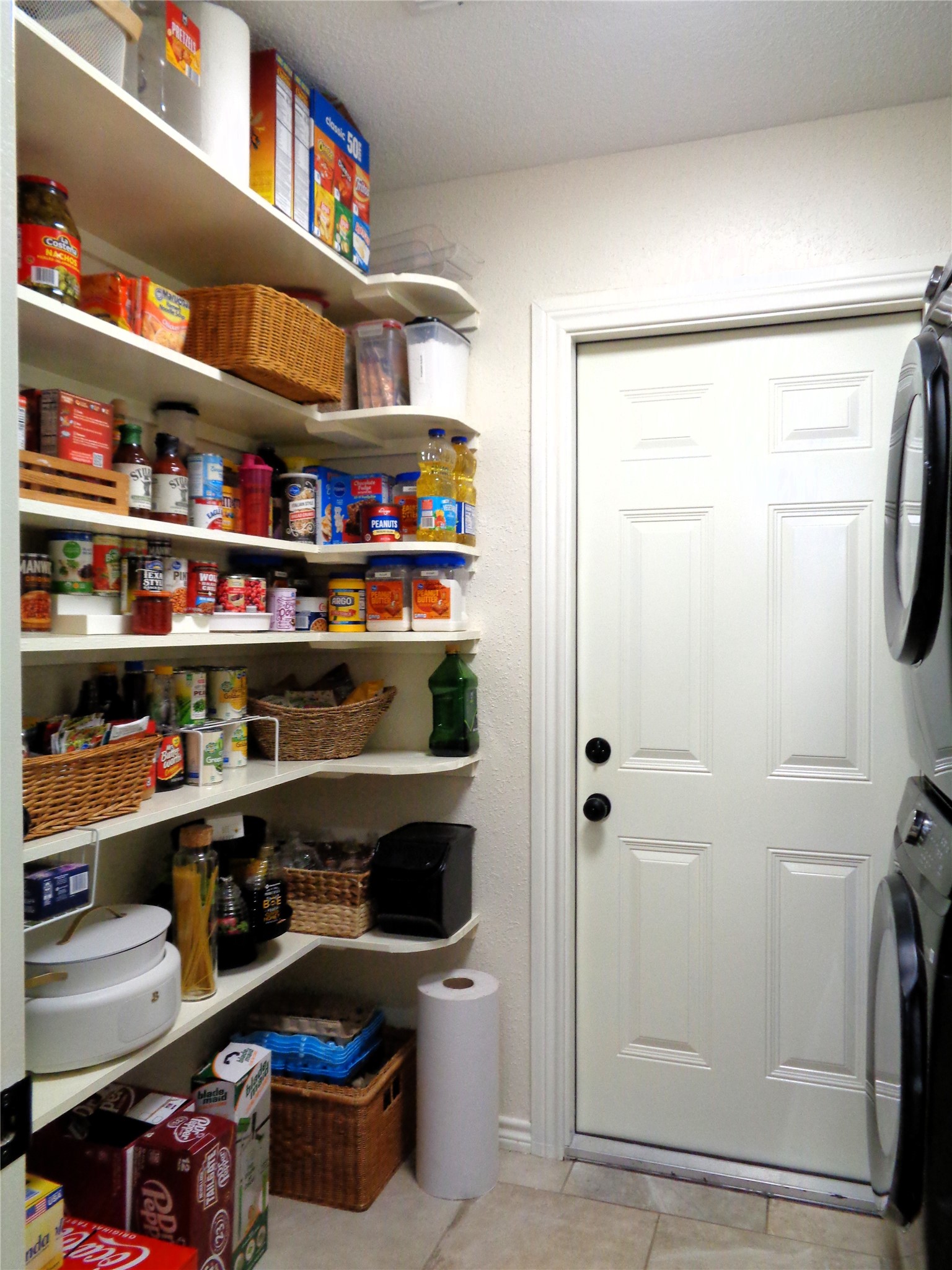 Walk-in pantry located just off the kitchen; there is another pantry located in the kitchen.