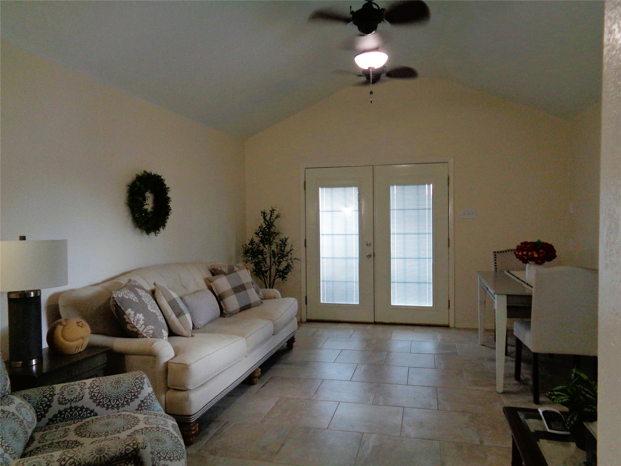 Bonus room - maybe another bedroom...? French doors lead out to the covered patio.