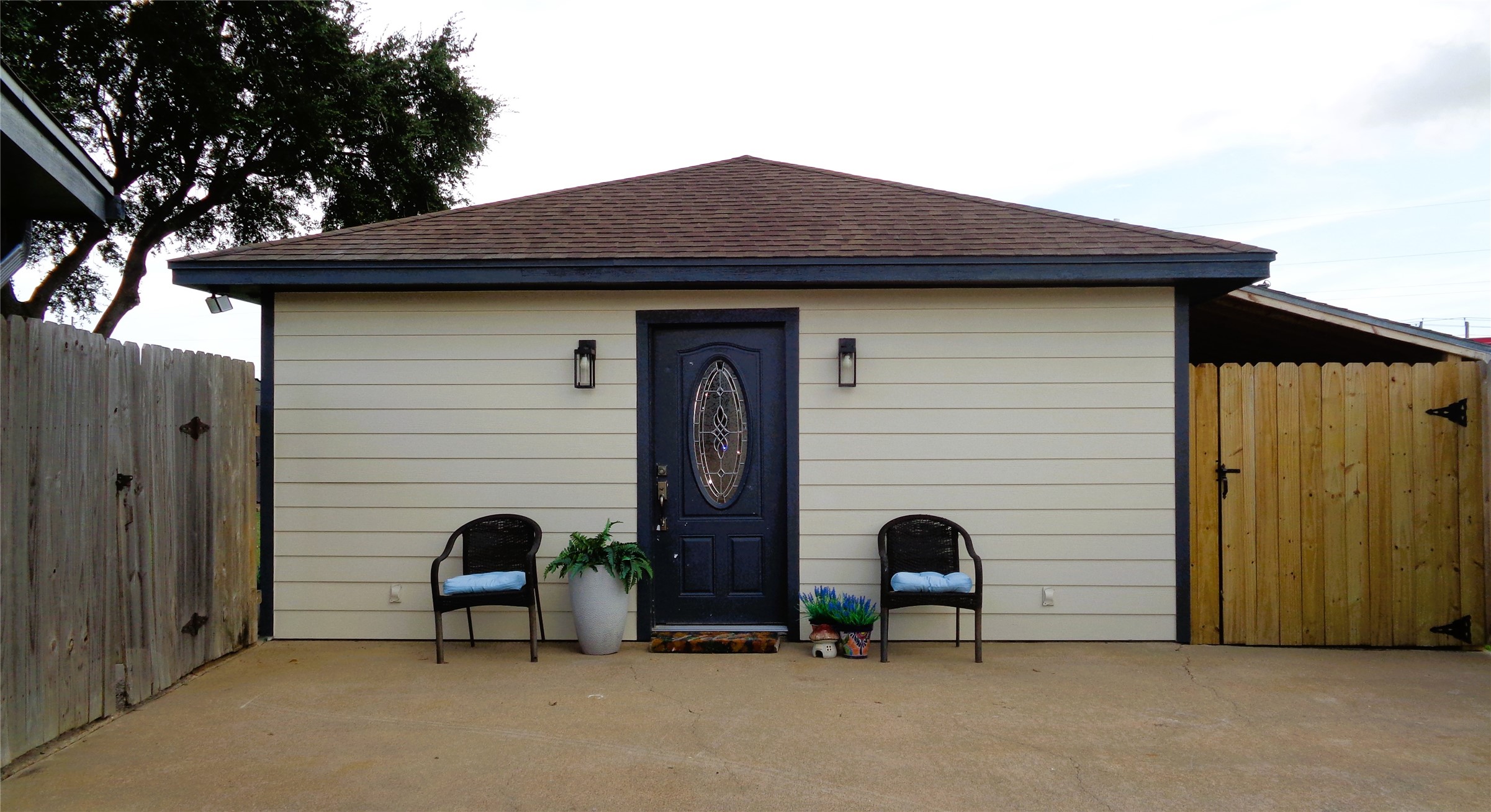 ADU has 2 entrances, separate from the main house.  This reflects the entrance from the driveway. It also has a sliding glass door on the east side viewing the back yard.