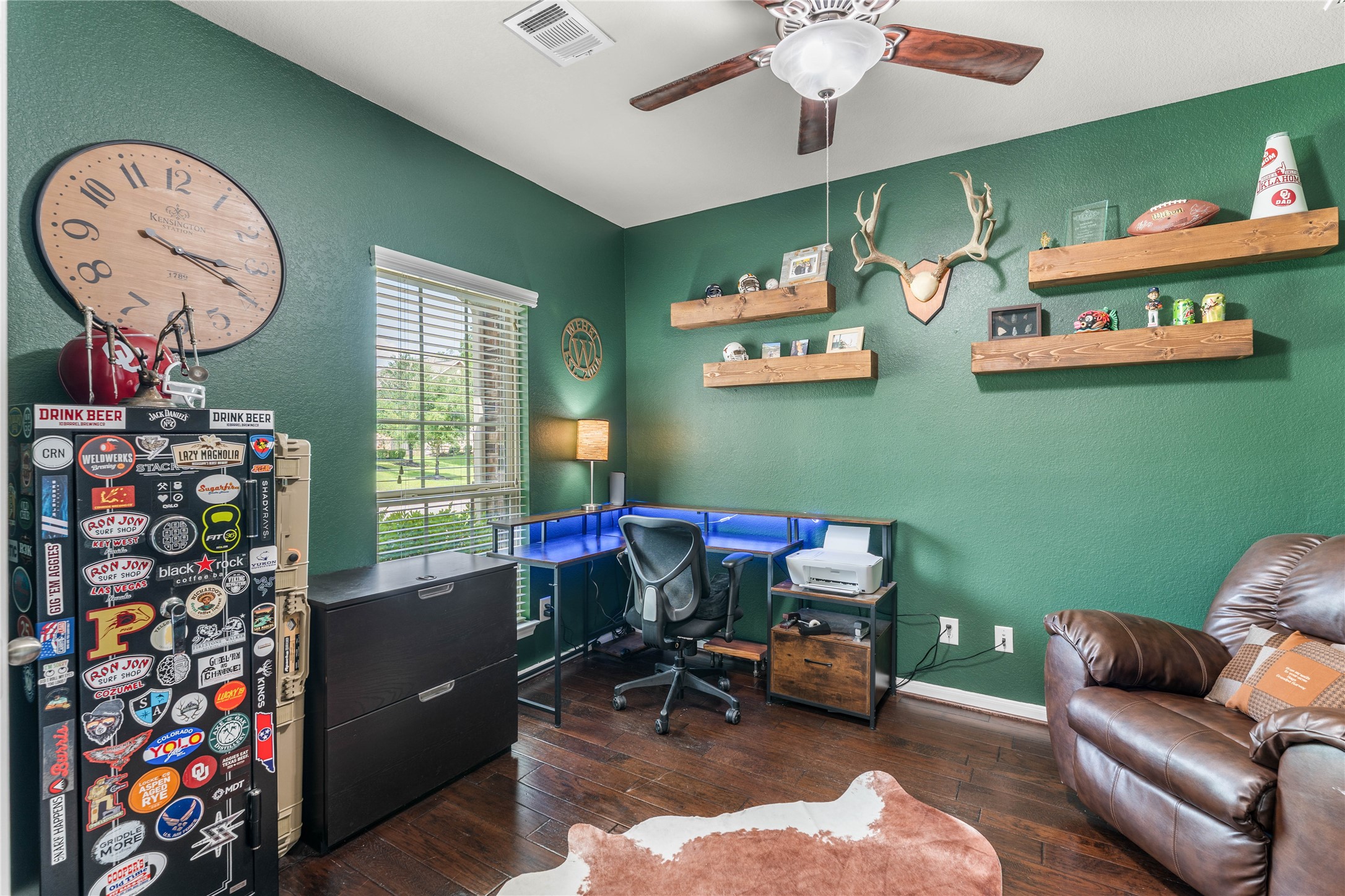 Dedicated home office with French doors and abundant natural light.