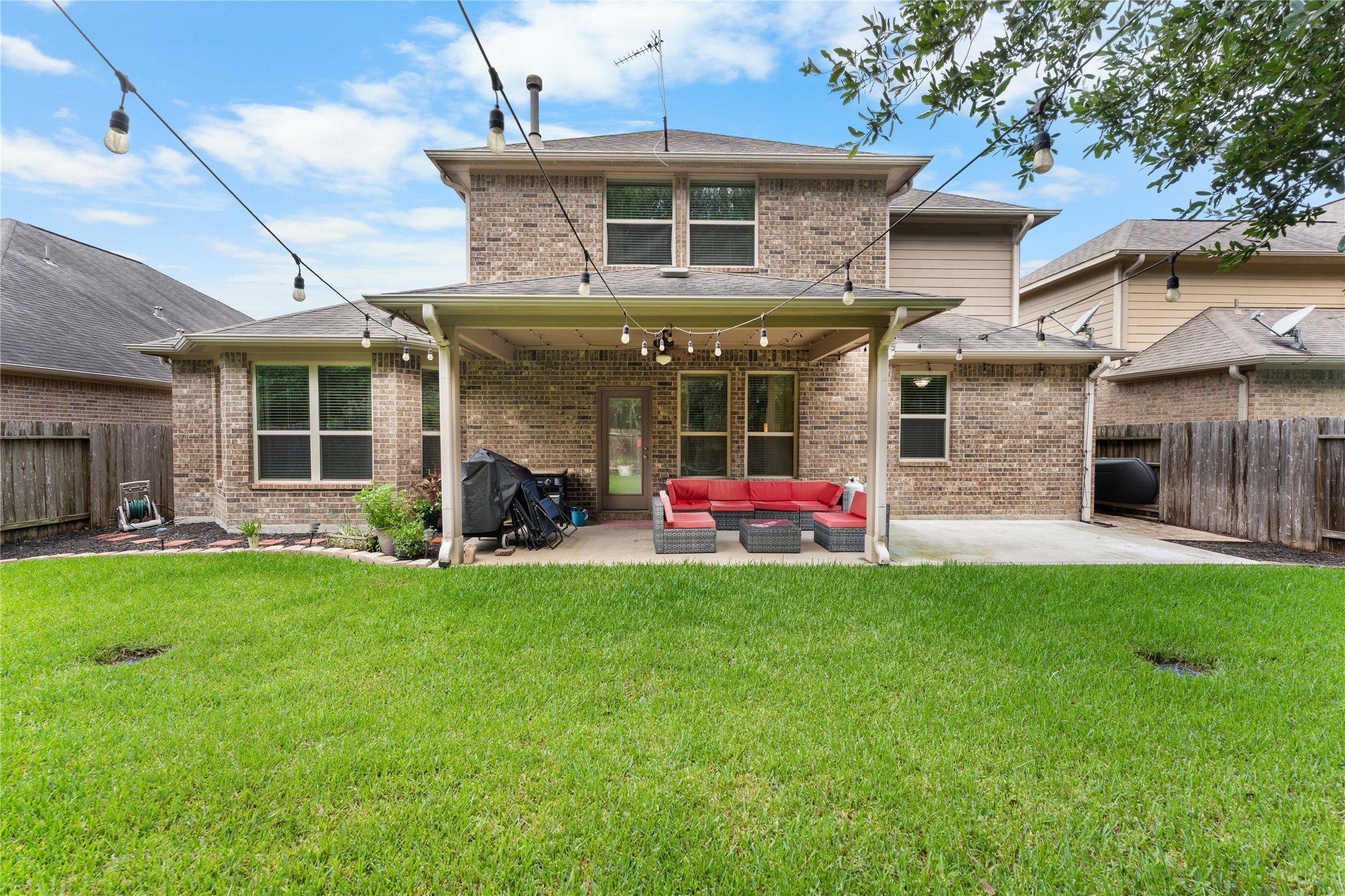Covered back patio overlooking a fully fenced backyard with room to enjoy the outdoors. Covered back patio overlooking a fully fenced backyard with room to enjoy the outdoors.