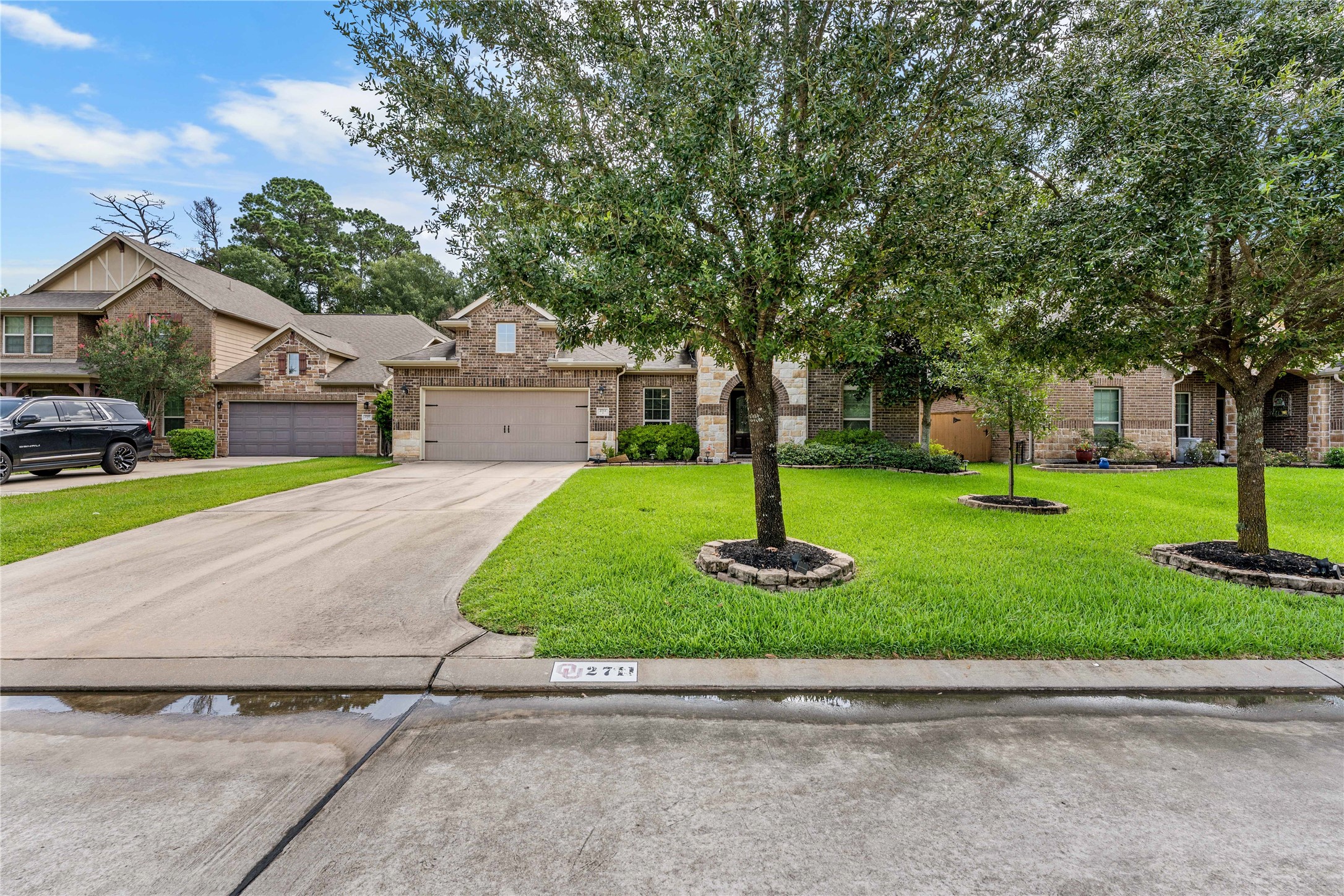 Front streetscape highlighting mature landscaping and neighborhood setting.