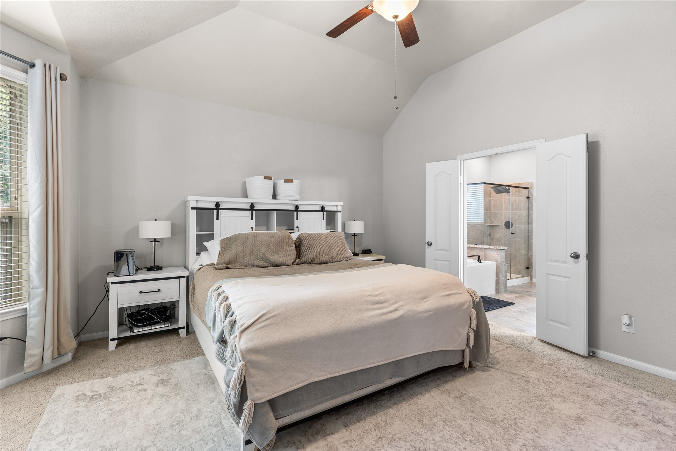 Primary bedroom with direct access to the ensuite bath.