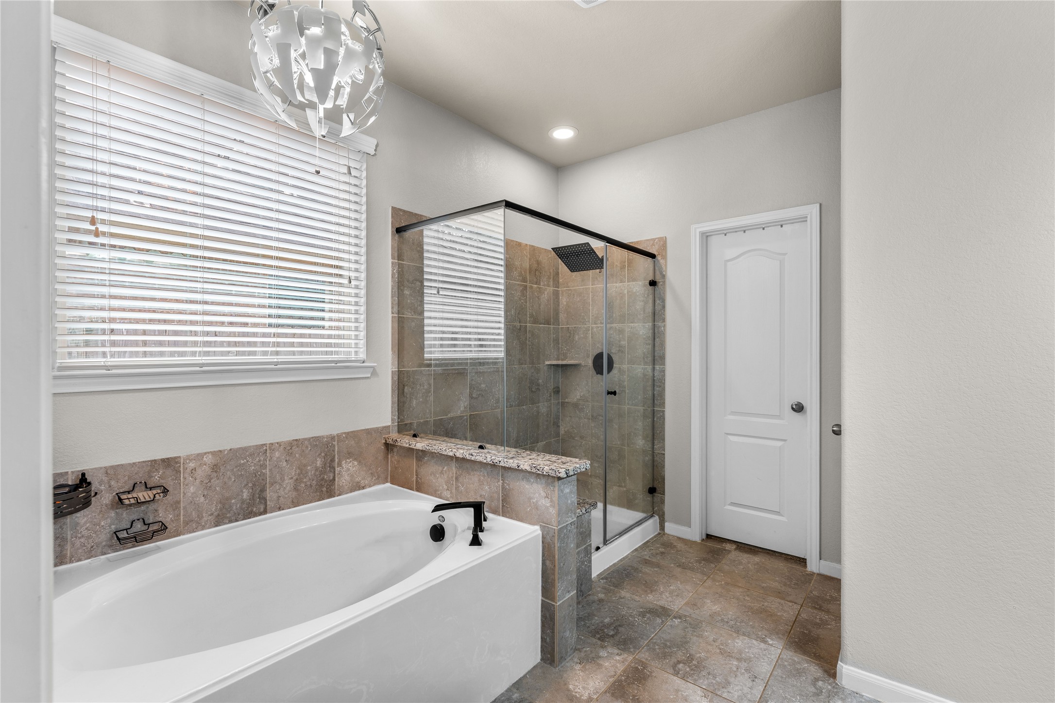 Soaking tub and separate shower.