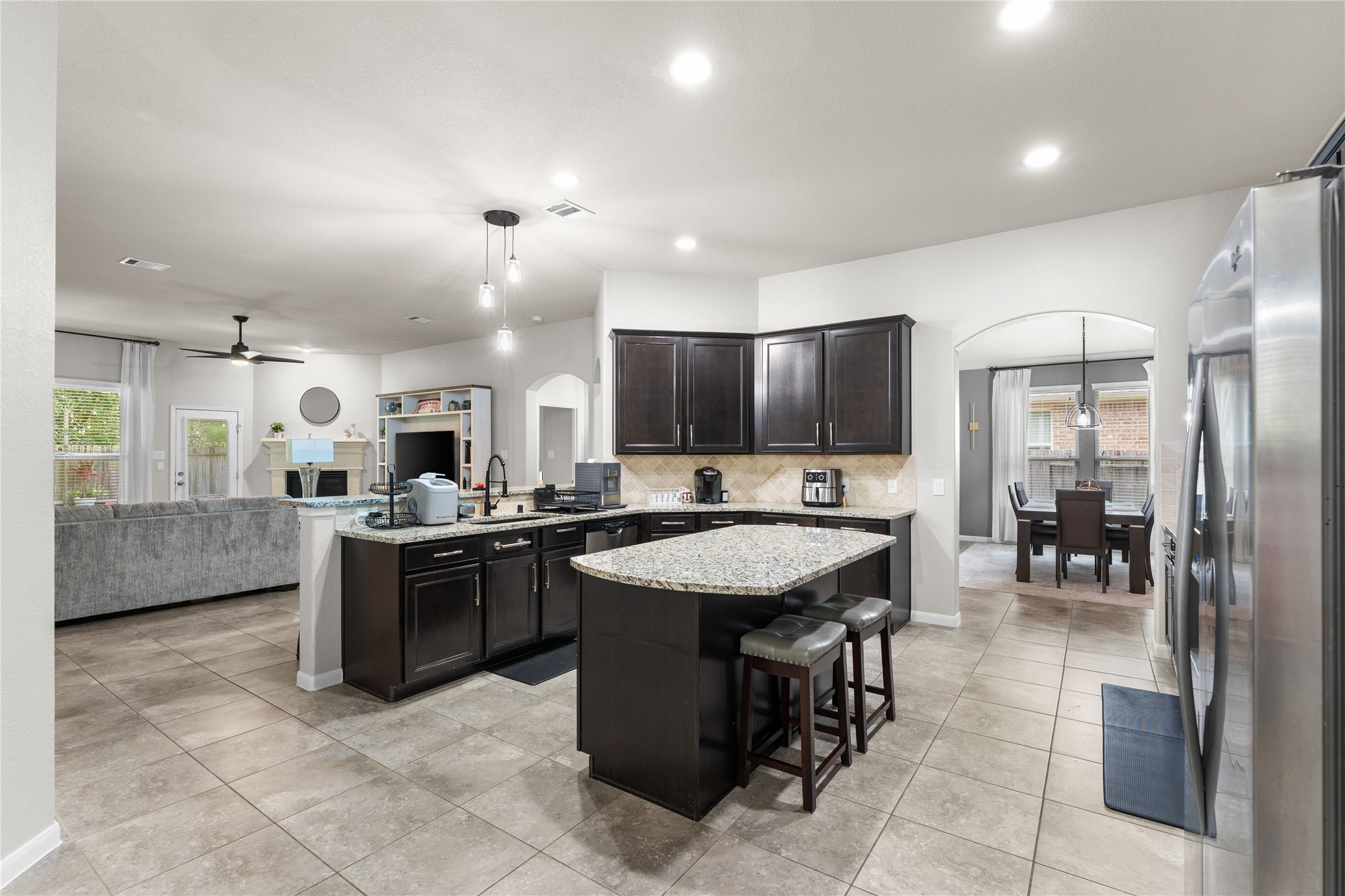 Open-concept design connecting the family room and kitchen for effortless entertaining.