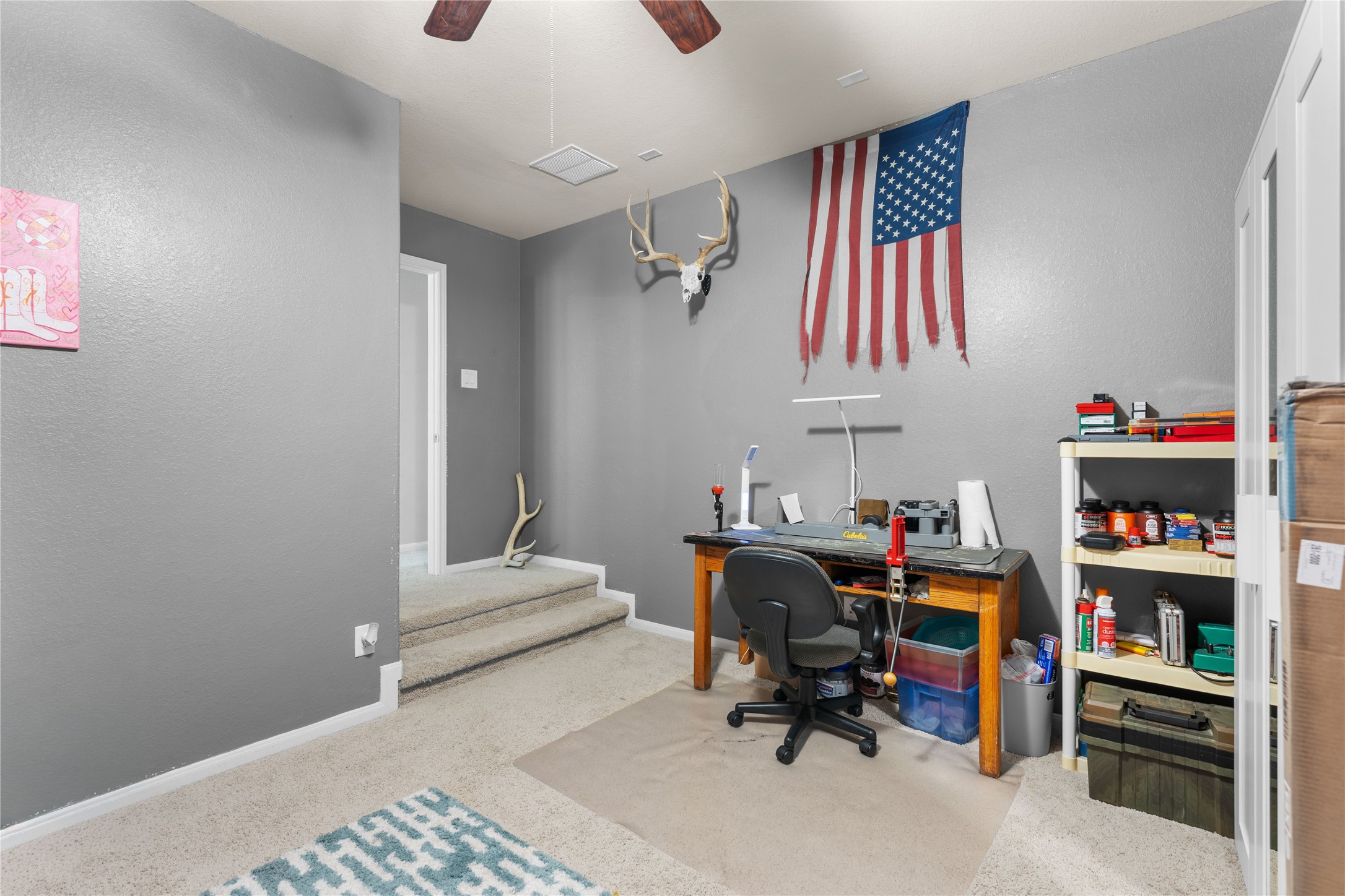 Media room with workspace and flexible functionality.