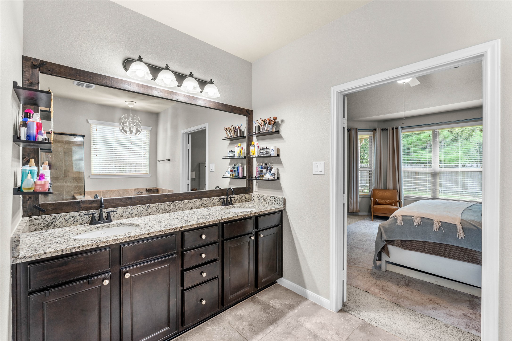 Spa-inspired primary bath featuring dual vanities.