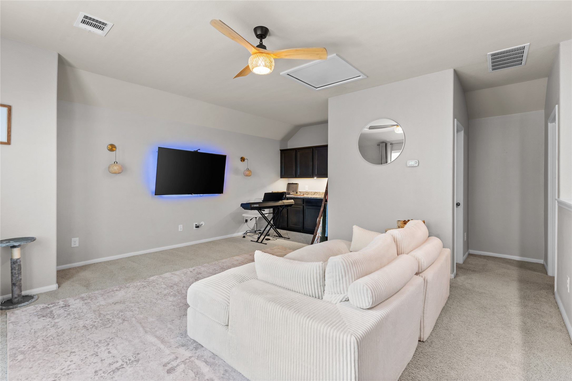 Flexible upstairs living area ideal for recreation, hobbies, or media use. Flexible upstairs living area ideal for recreation, hobbies, or media use.