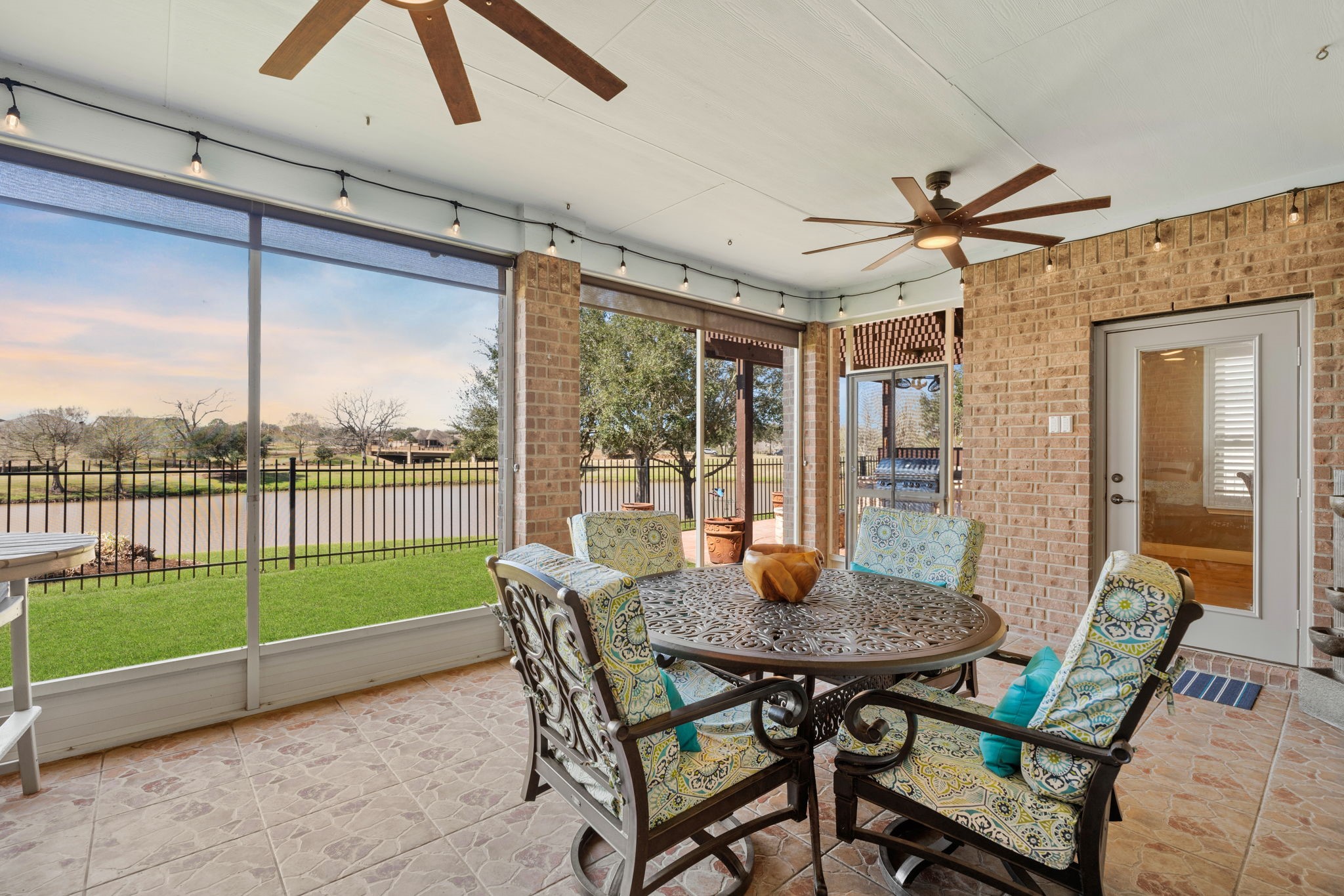 The screened-in porch beckons you to relax and savor the water views and the soothing presence of mature treesa perfect space to unwind and immerse yourself in tranquility.